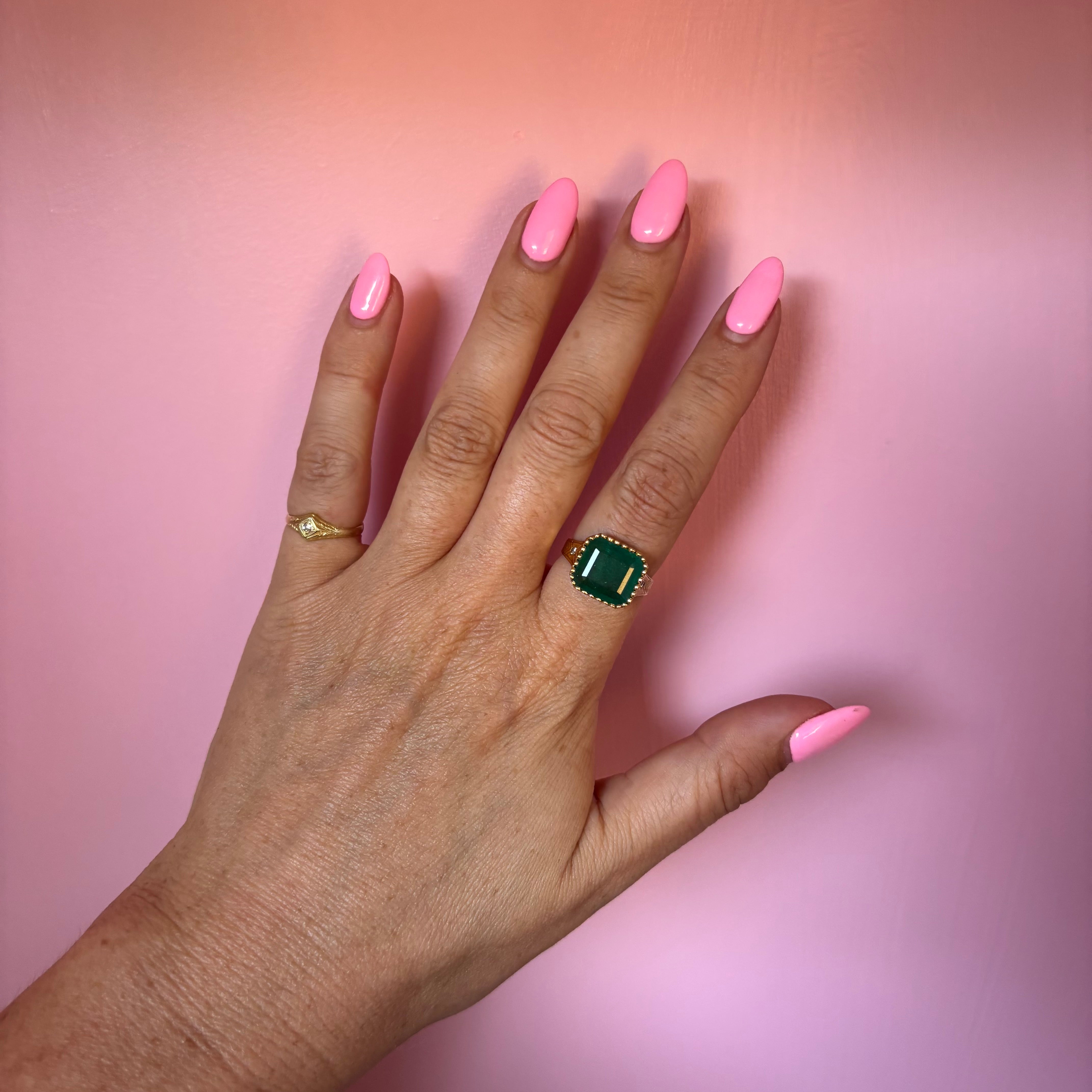 14ct gold 10.80ct Asscher cut emerald and diamond ring with engraved shoulders