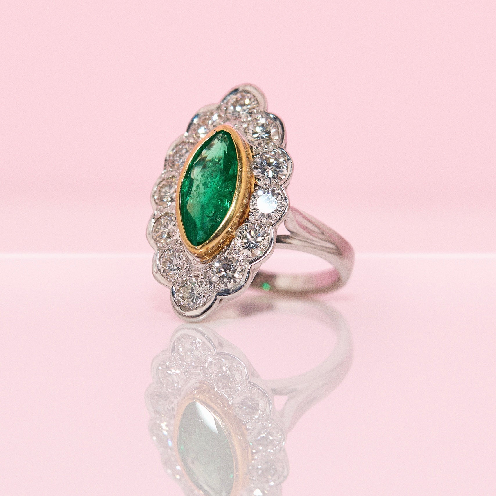 18ct white gold bezel set marquise emerald and diamond ring