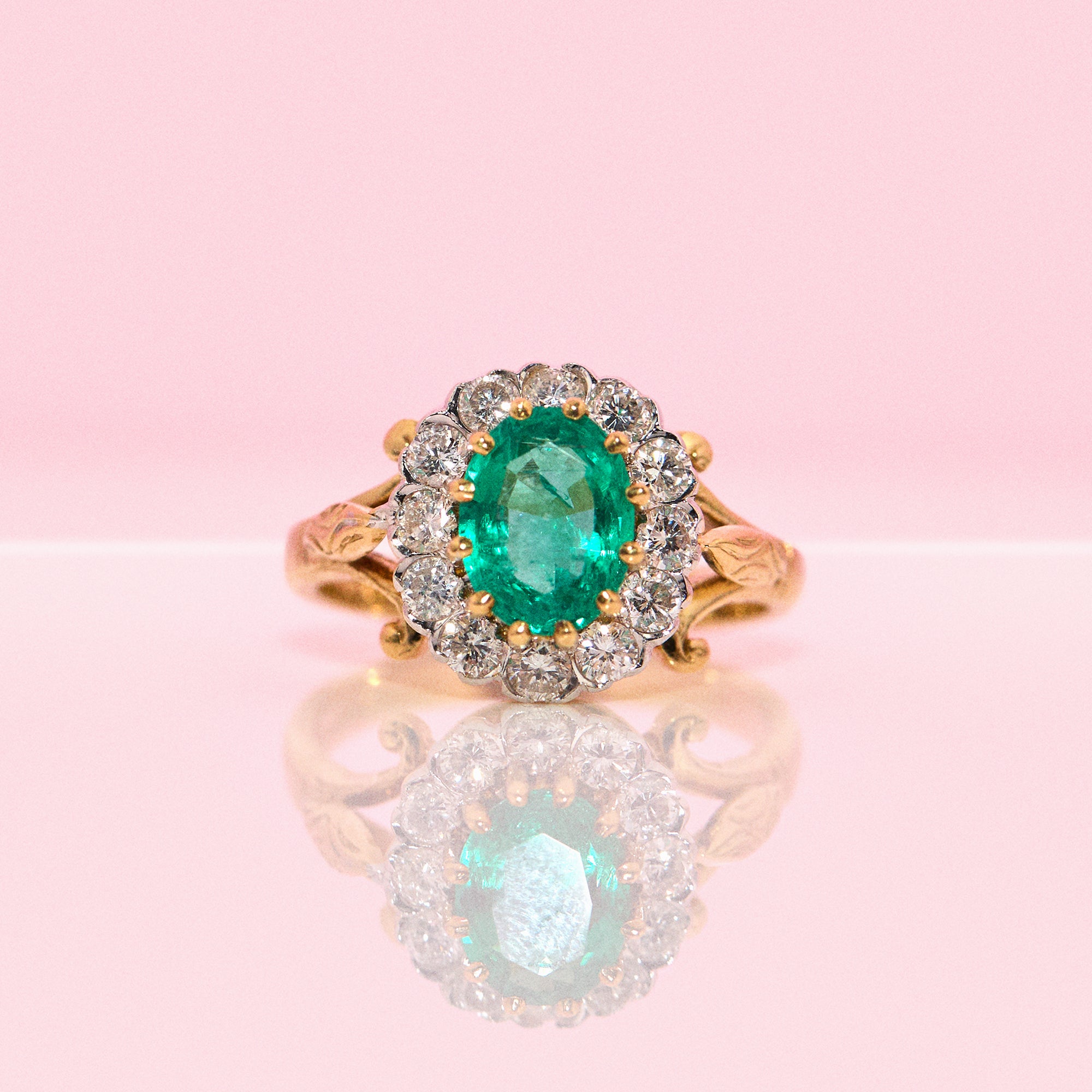 18ct gold emerald and diamond cluster ring