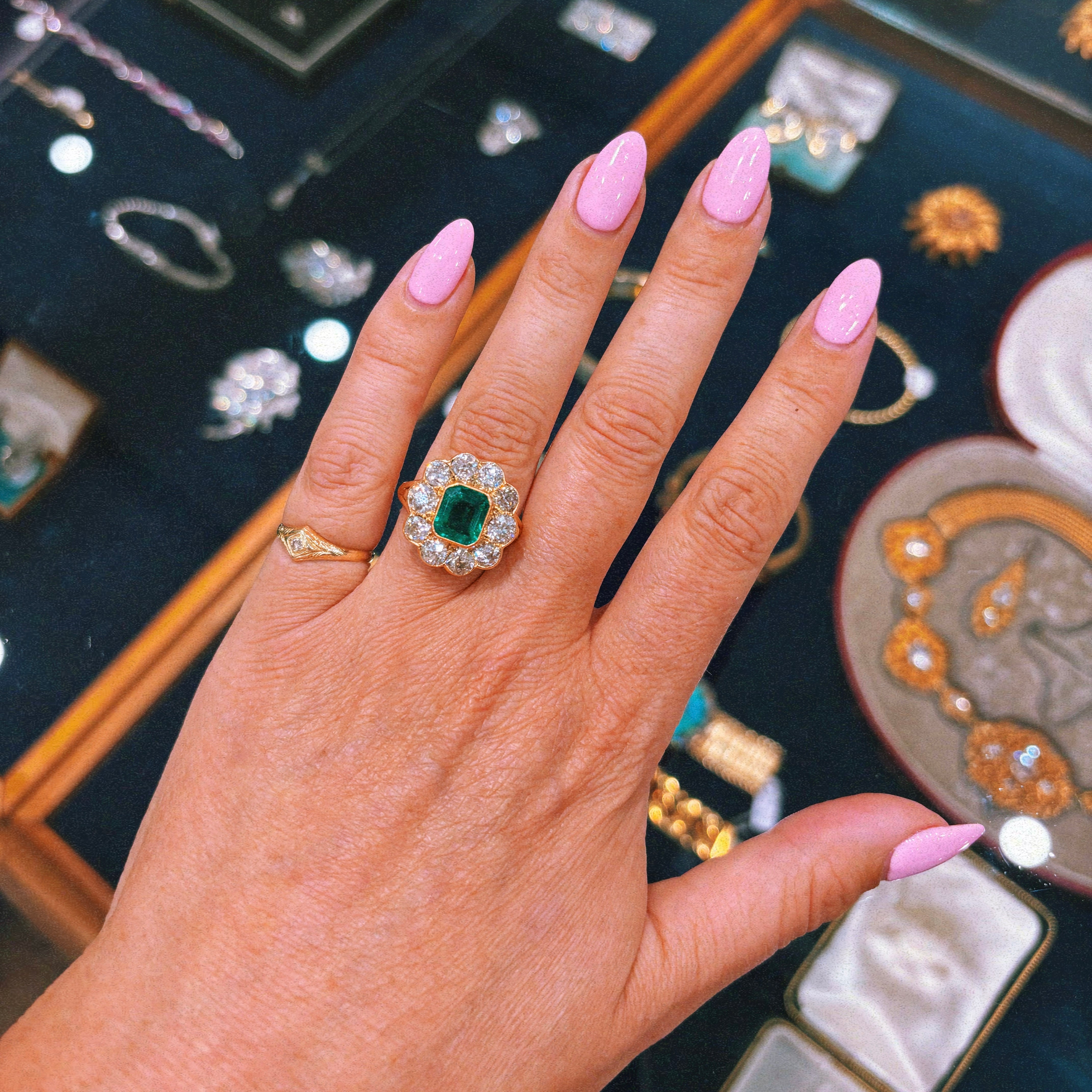 18ct gold 1.74ct Columbian emerald and 2.60ct diamond cluster ring