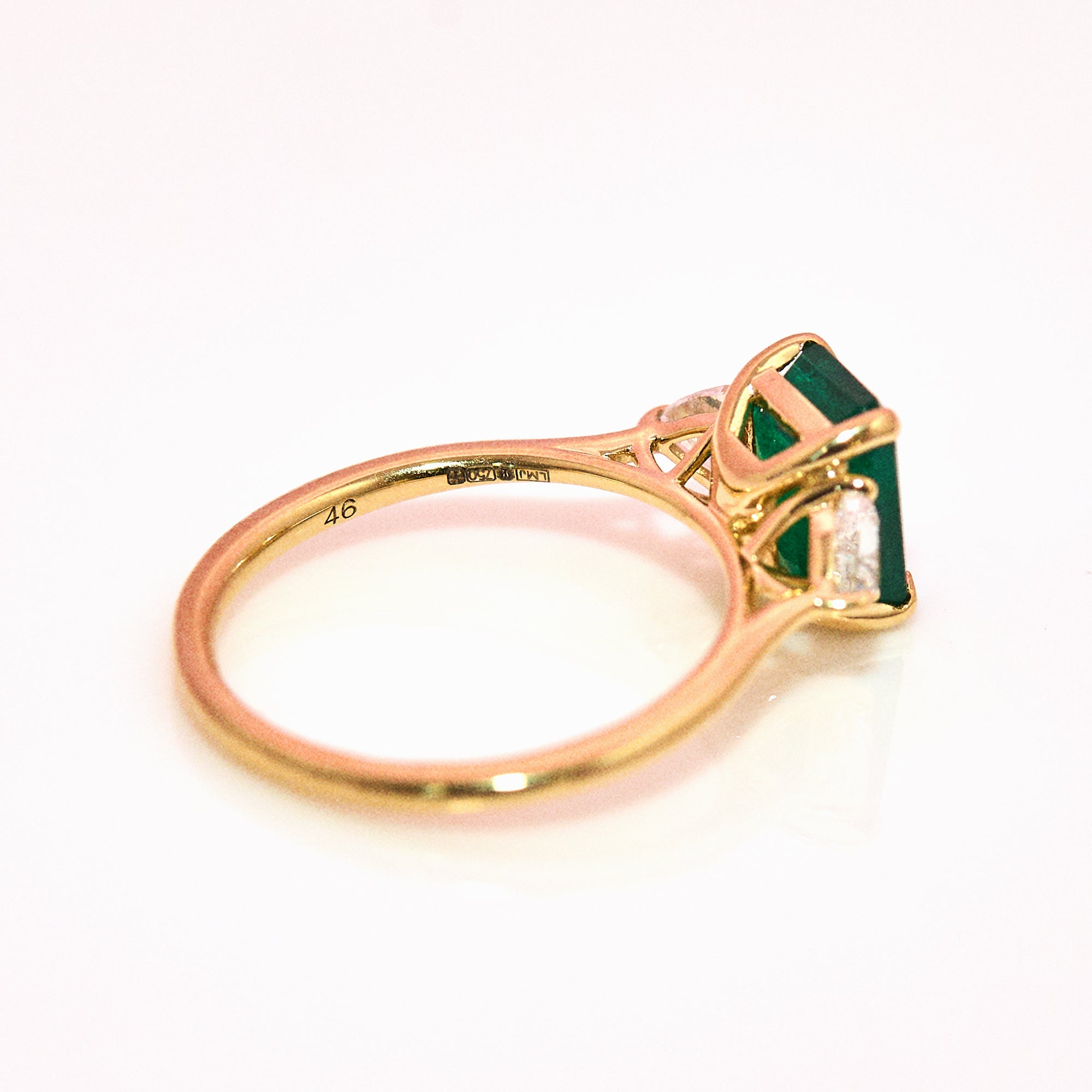 18ct gold emerald and diamond trillion three stone ring