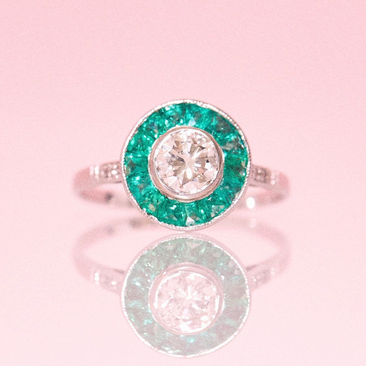 Platinum 1.10ct diamond and emerald ring