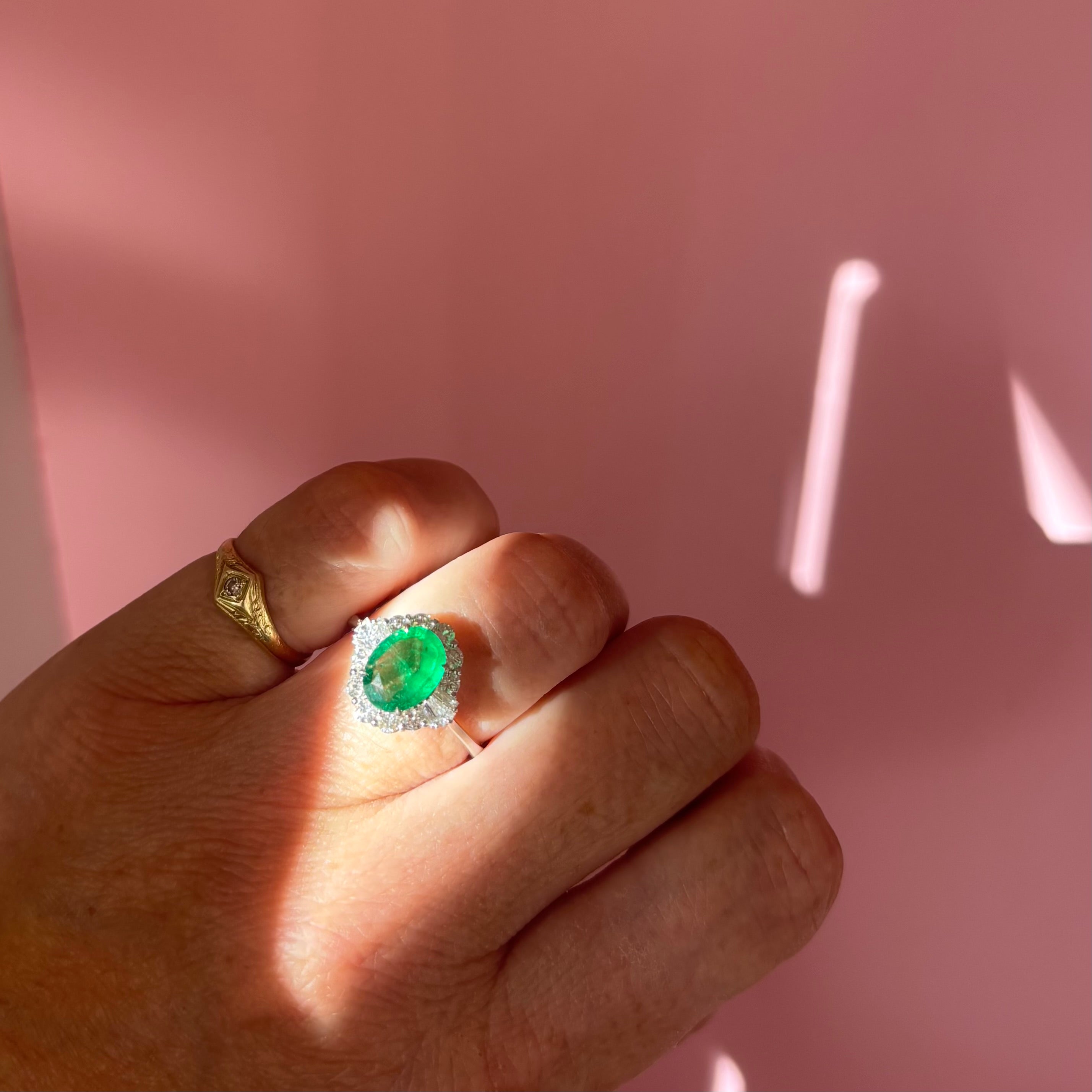 18ct white gold oval emerald and baguette diamond cluster ring