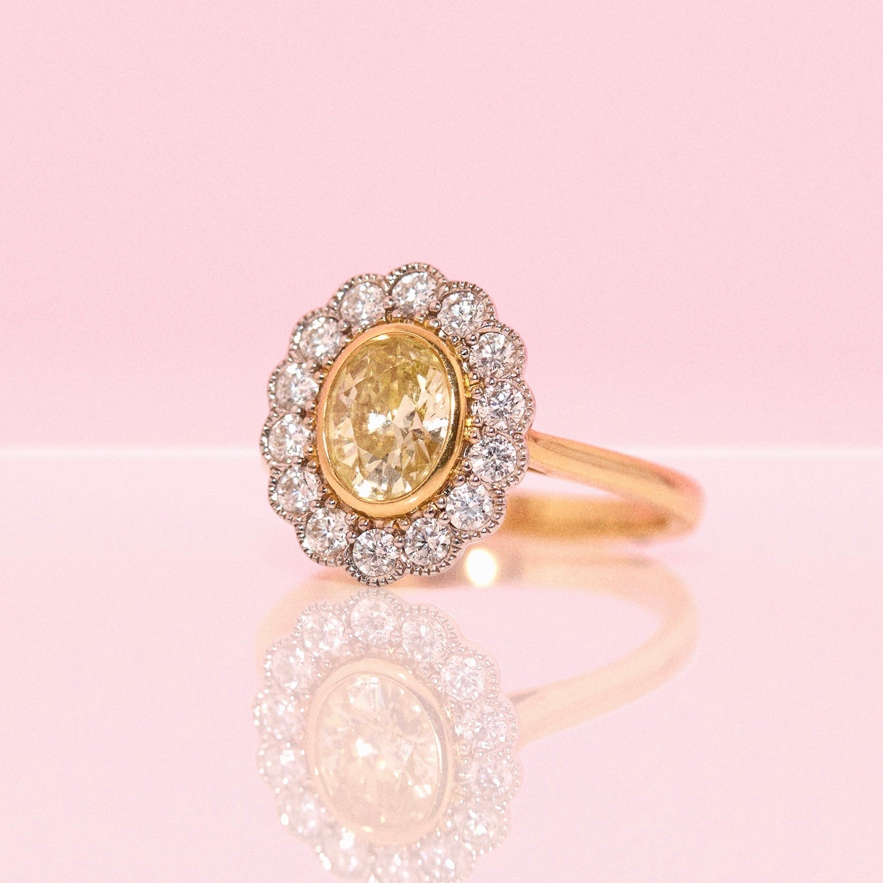 18ct gold 1.0ct oval, yellow diamond flower ring