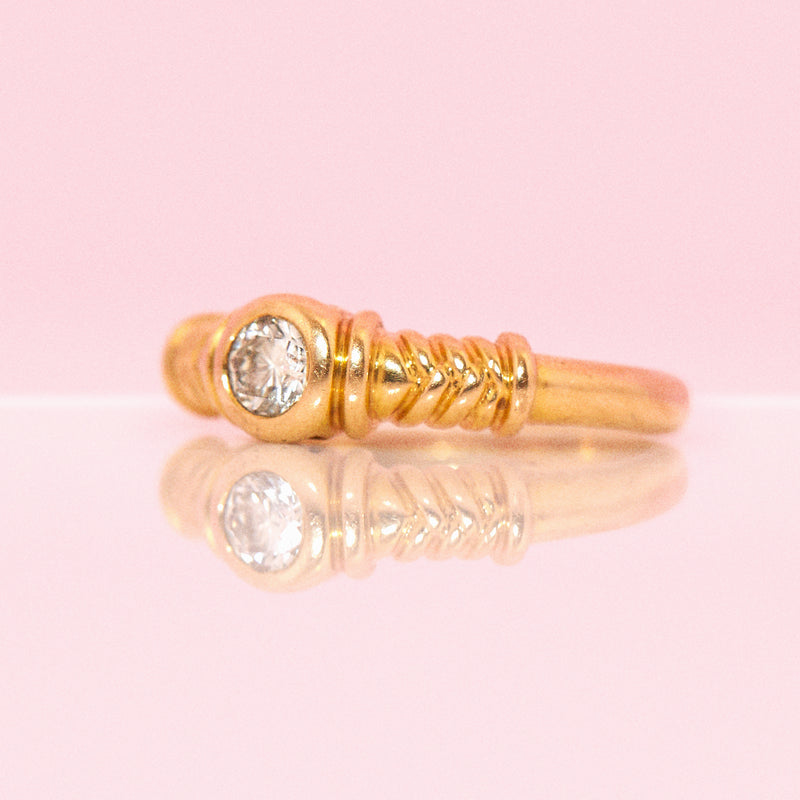 18ct gold rubover diamond ring with rubbed shoulders