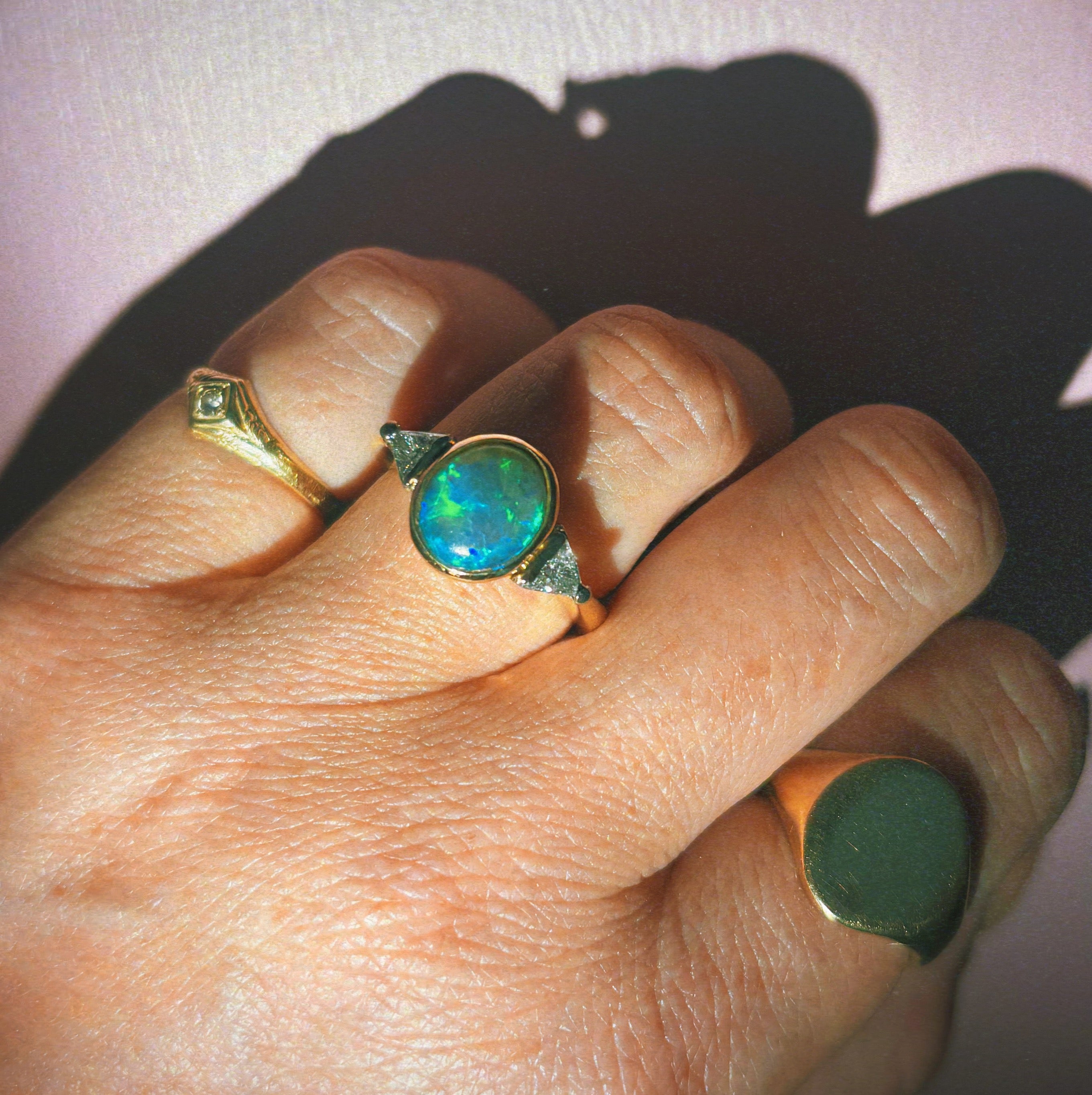 18ct gold bezel set black opal and diamond ring