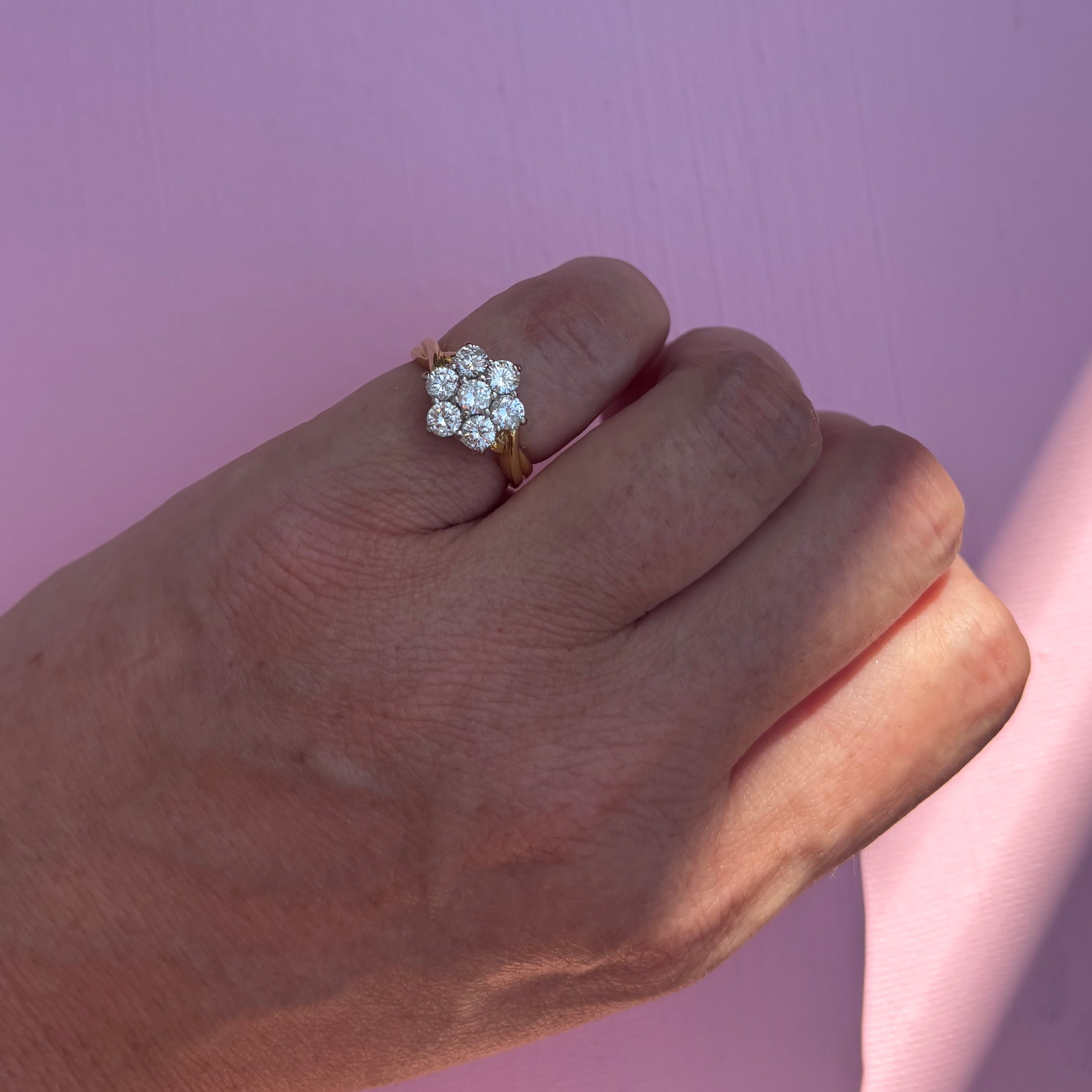 18ct gold diamond flower ring with a twisted band