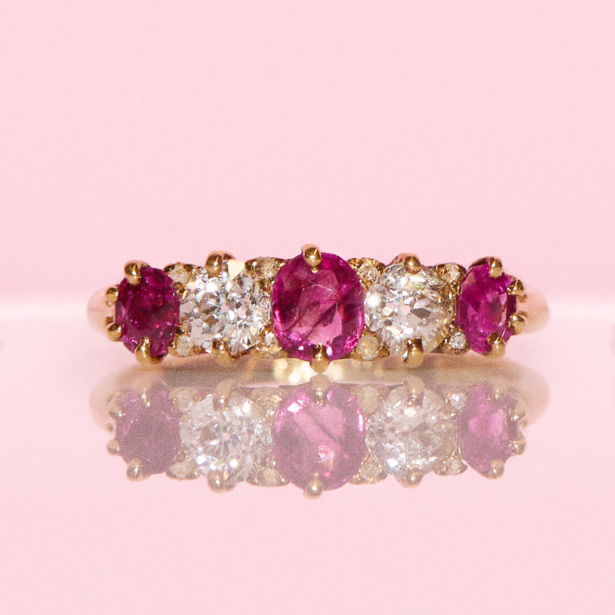 Vintage 18ct gold 0.70ct ruby and 0.40ct diamond half eternity ring