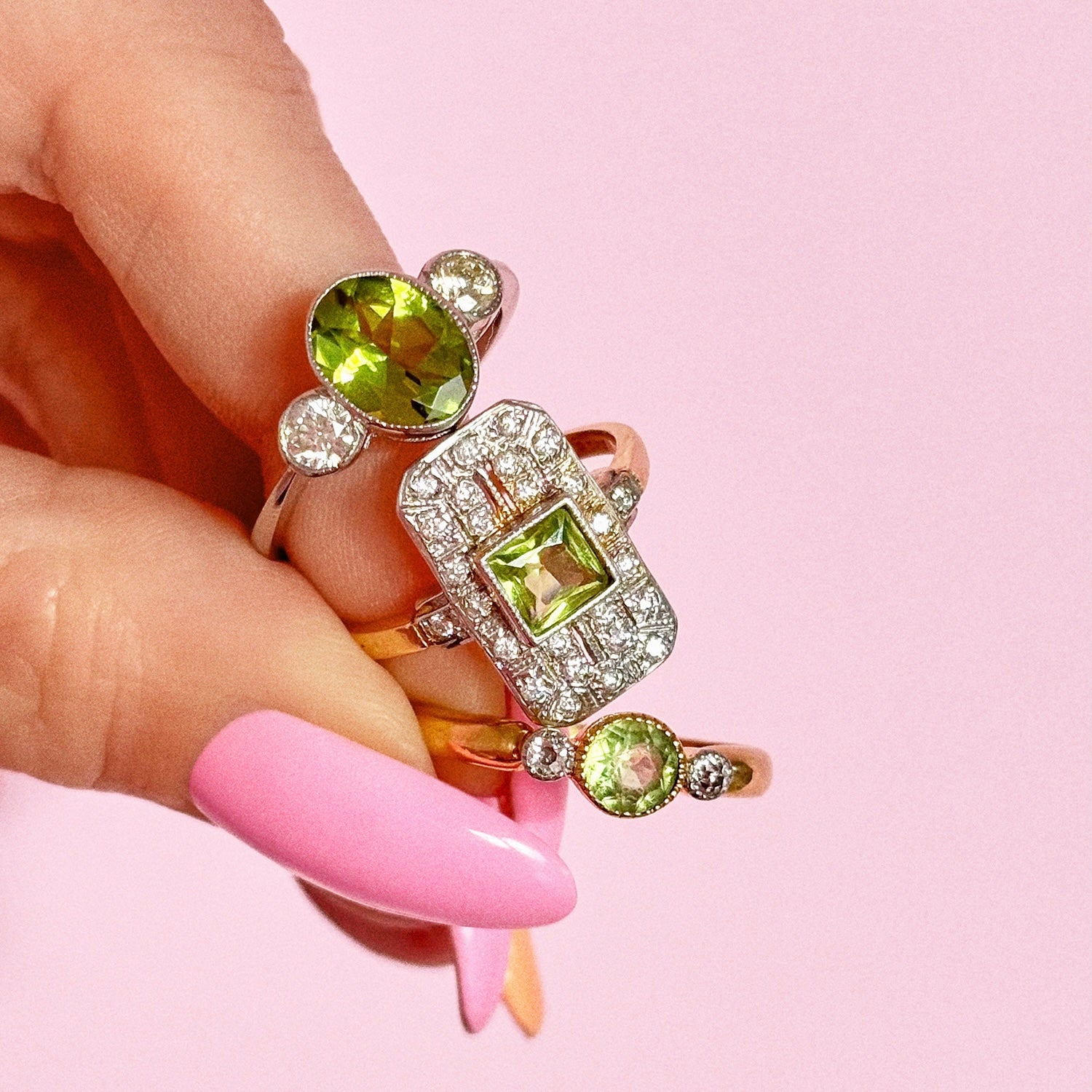 Platinum peridot and diamond three stone ring