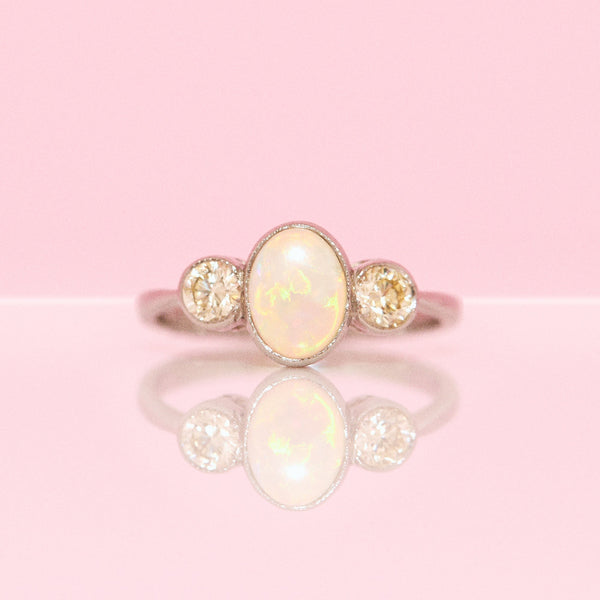 Platinum opal and diamond three stone ring