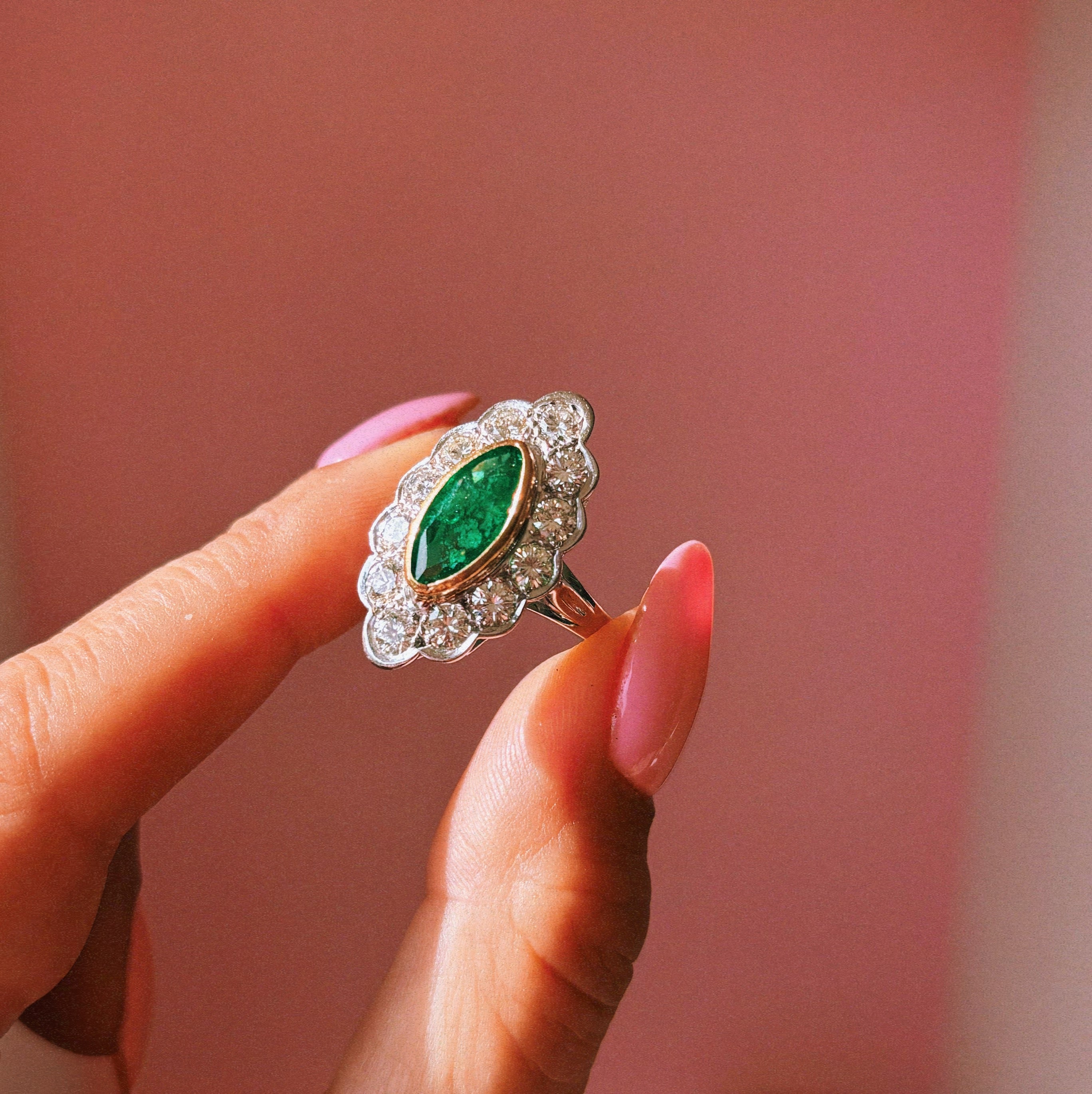18ct white gold bezel set marquise emerald and diamond ring