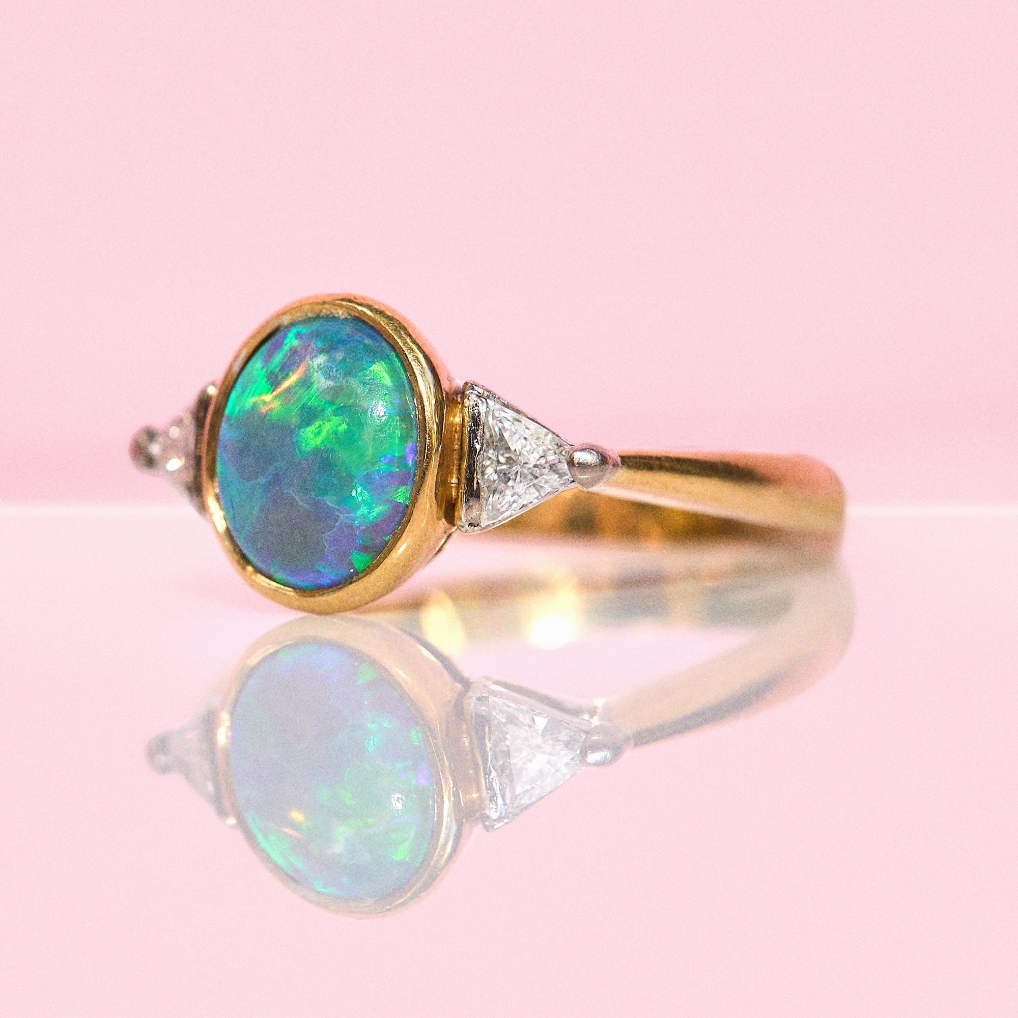 18ct gold bezel set black opal and diamond ring