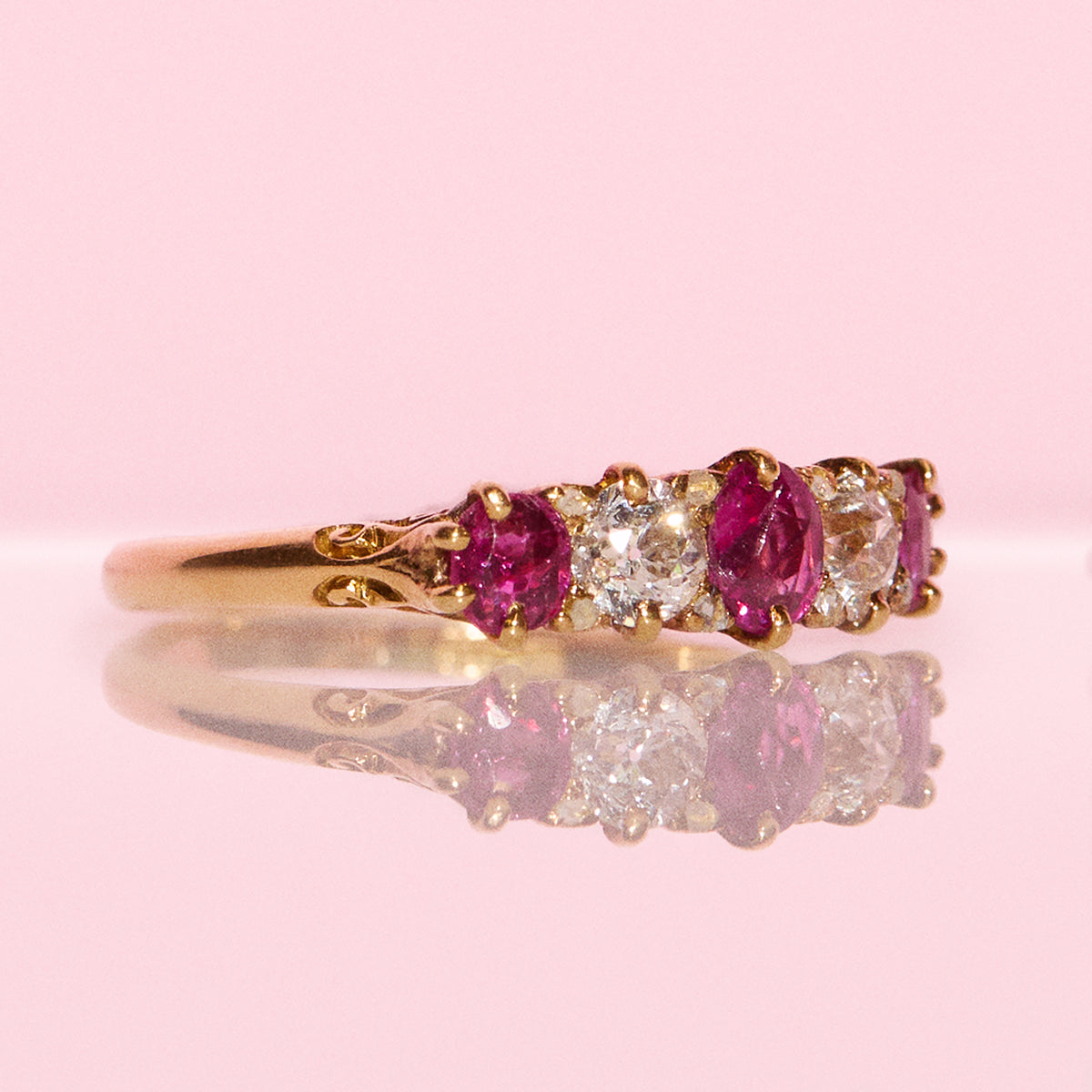 Vintage 18ct gold 0.70ct ruby and 0.40ct diamond half eternity ring