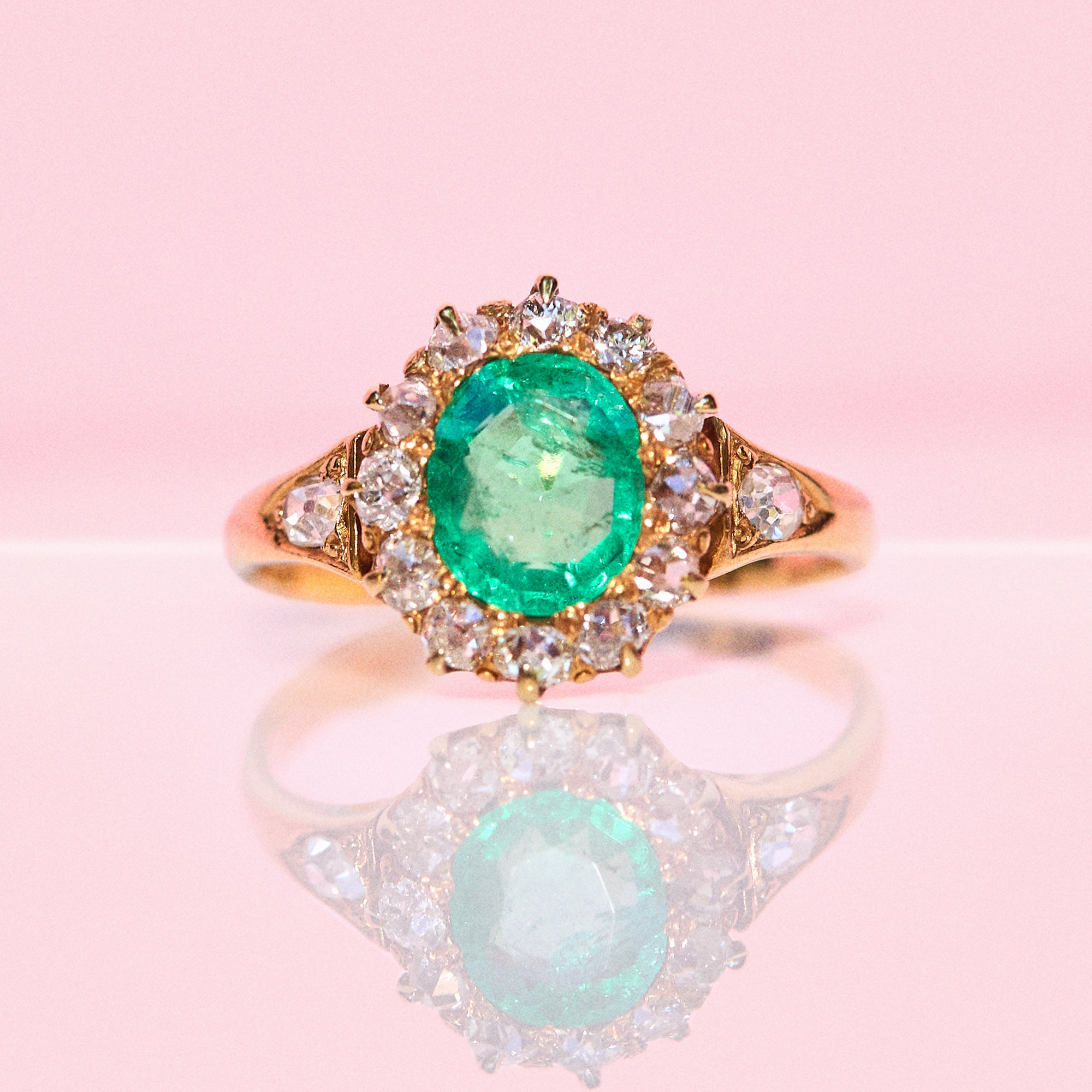 18ct gold emerald and diamond cluster ring
