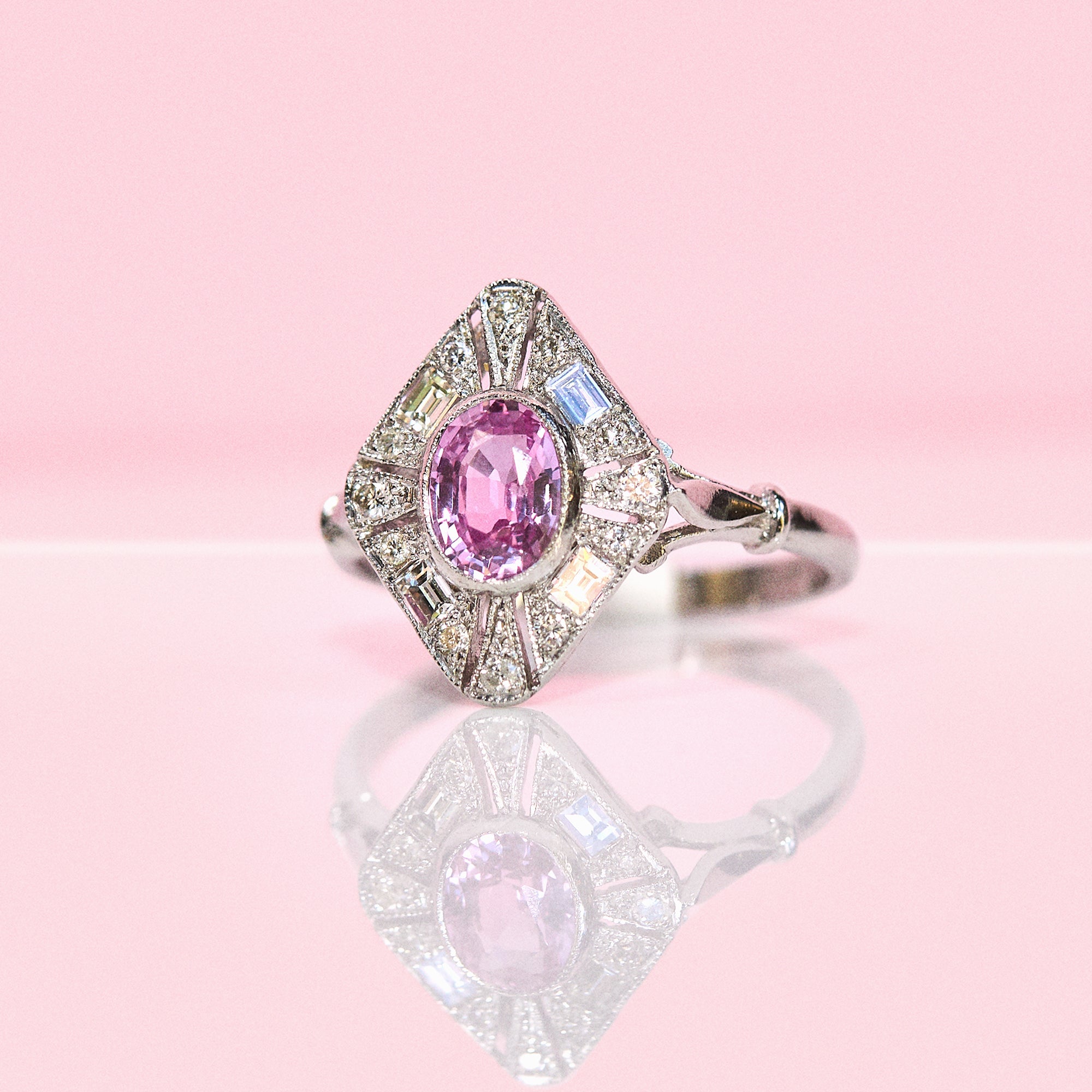 Platinum pink sapphire and diamond cluster ring
