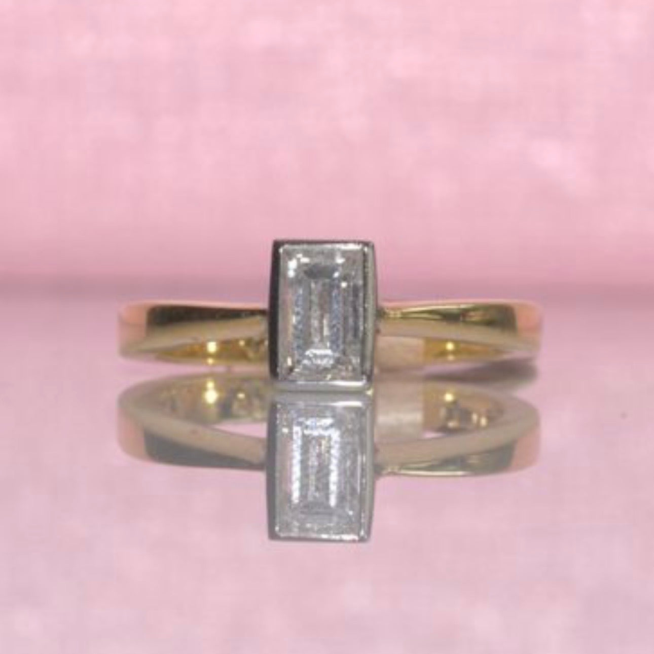 18ct gold 0.71ct emerald cut bezel set diamond ring