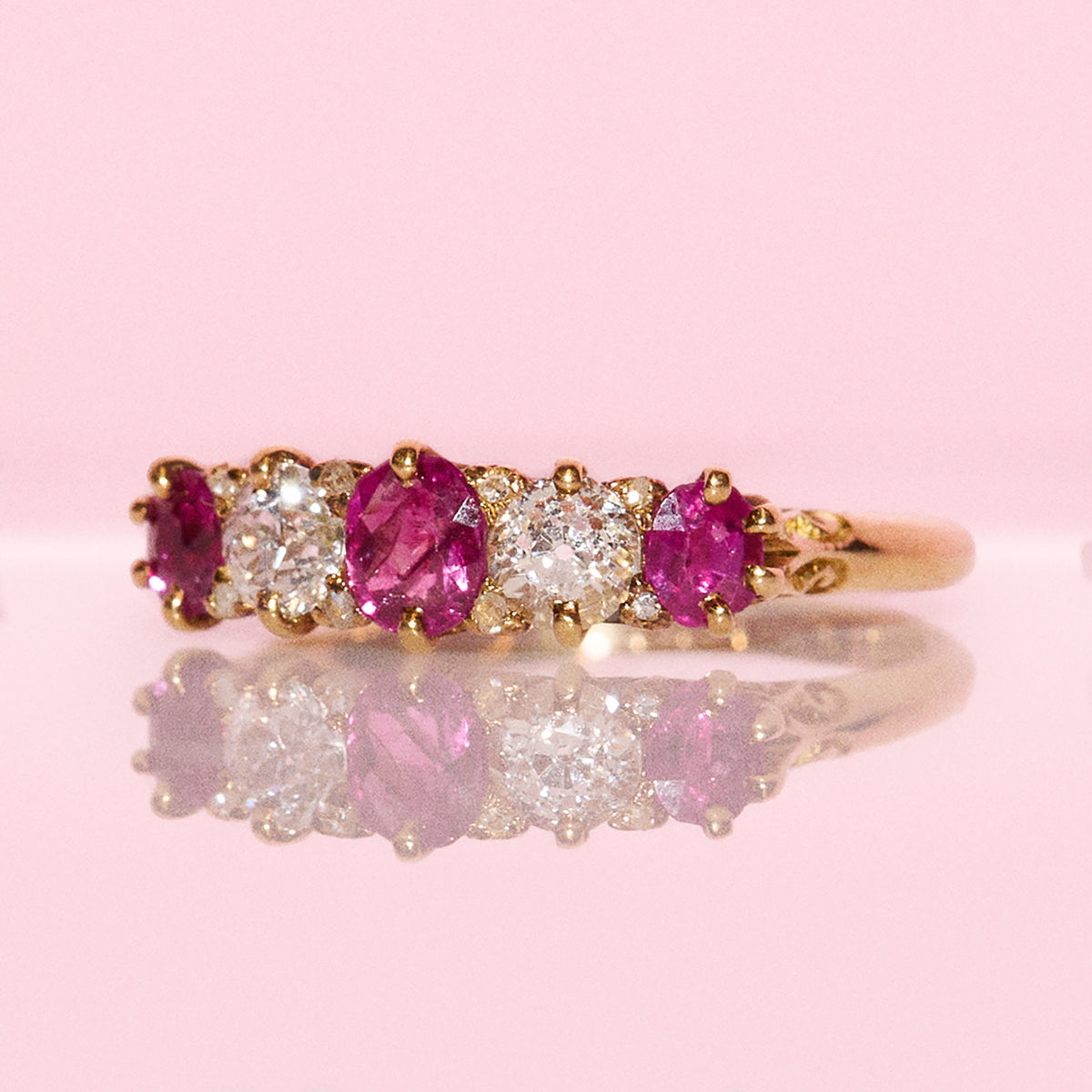 Vintage 18ct gold 0.70ct ruby and 0.40ct diamond half eternity ring