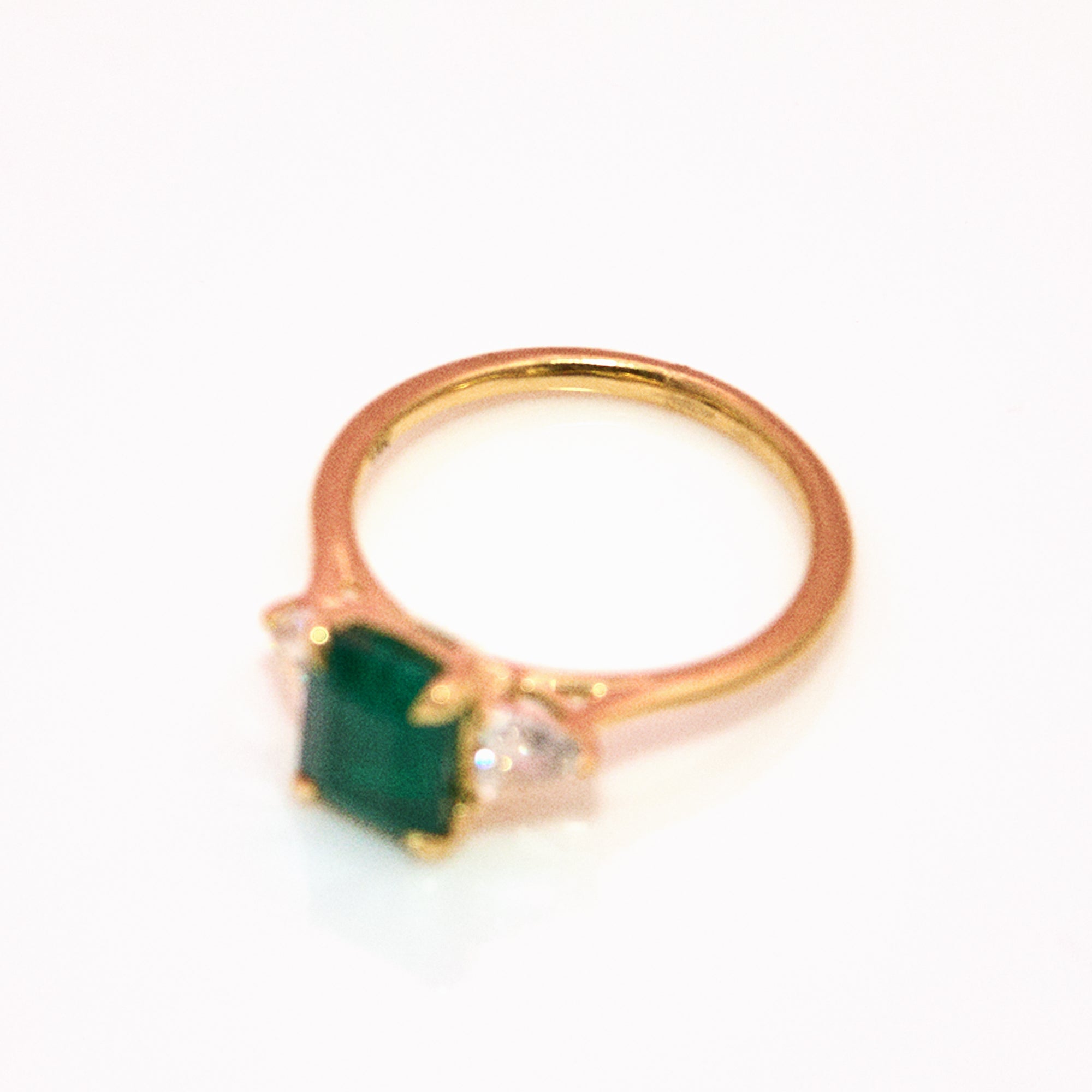 18ct gold emerald and diamond trillion three stone ring