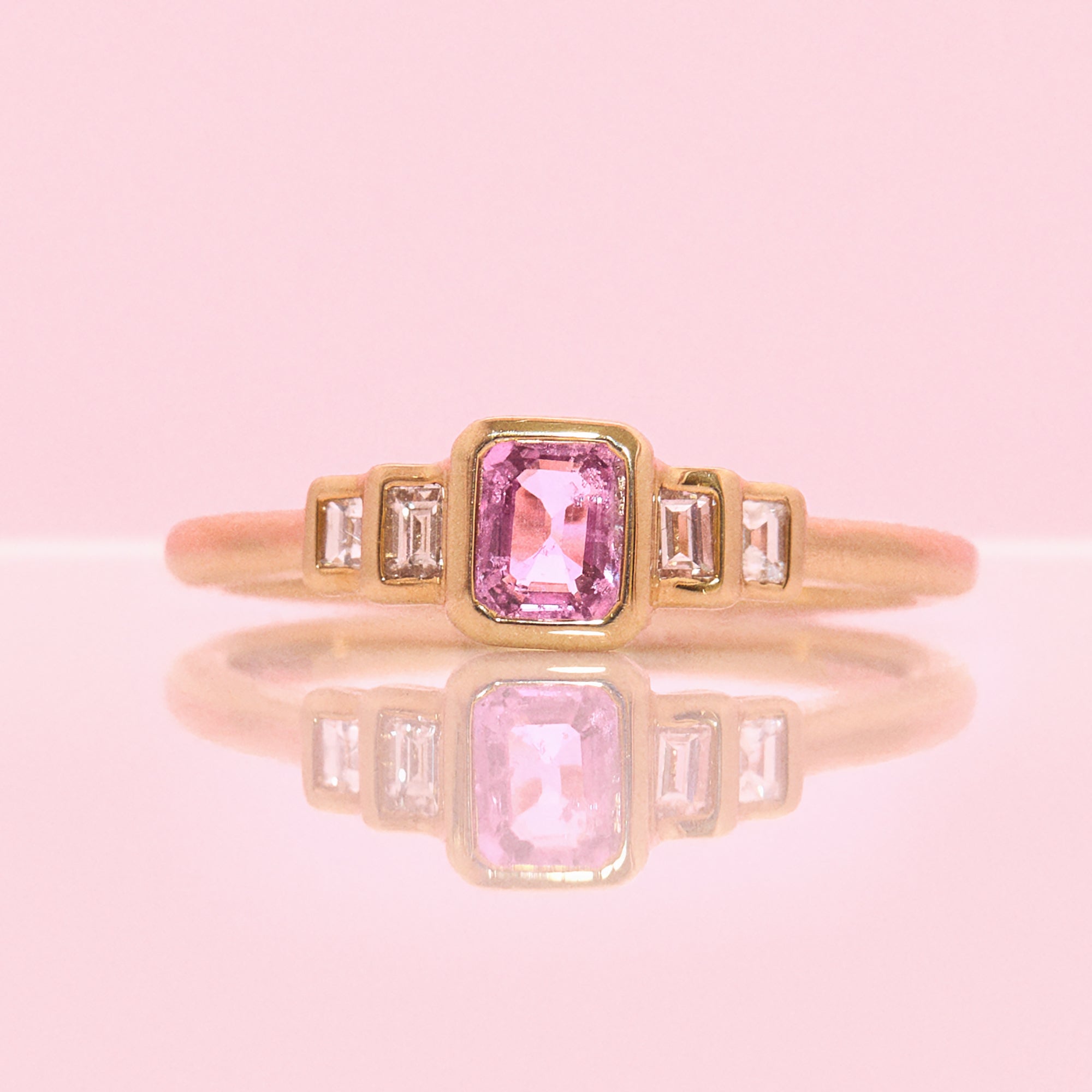 9ct gold 0.52ct emerald cut pink sapphire and baguette diamond three stone ring (made to order)