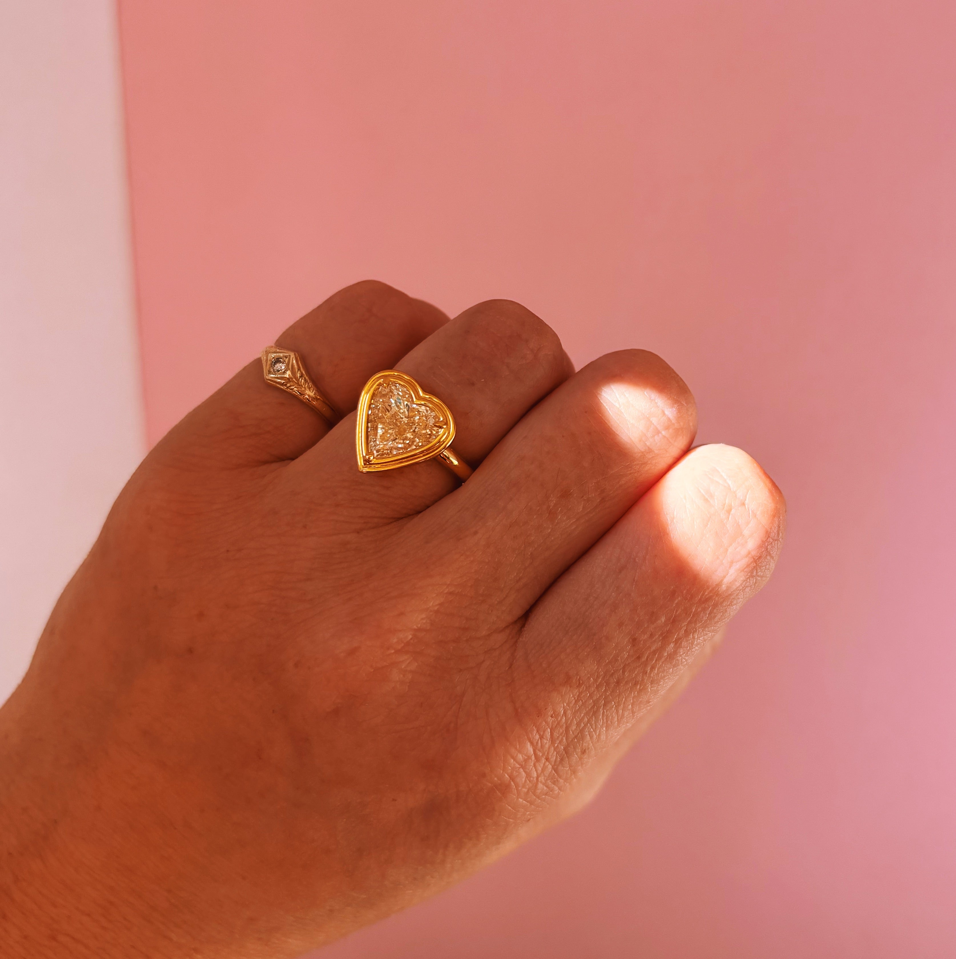 18ct gold bezel set fancy yellow 2.35ct heart-shaped diamond ring
