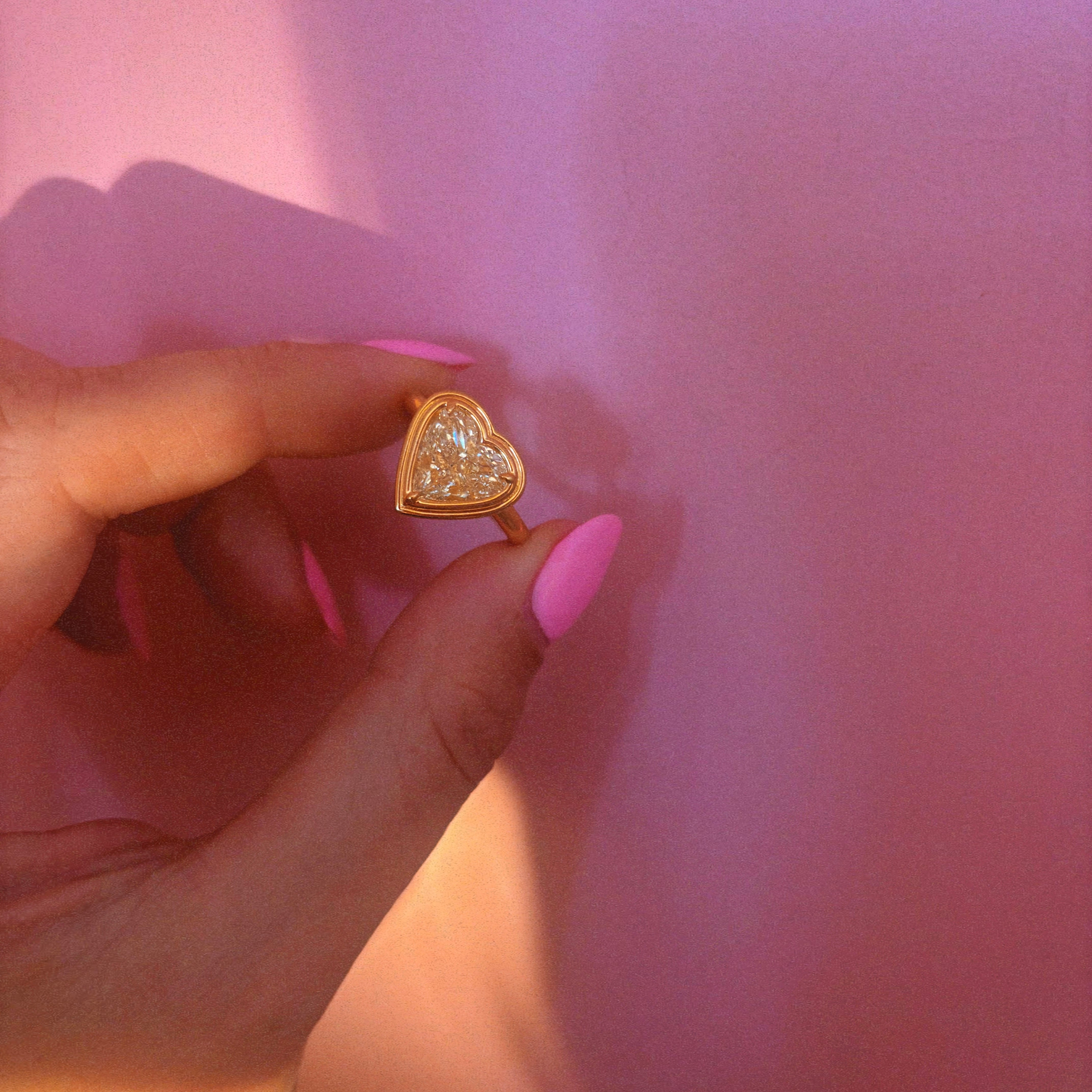 18ct gold bezel set fancy yellow 2.35ct heart-shaped diamond ring
