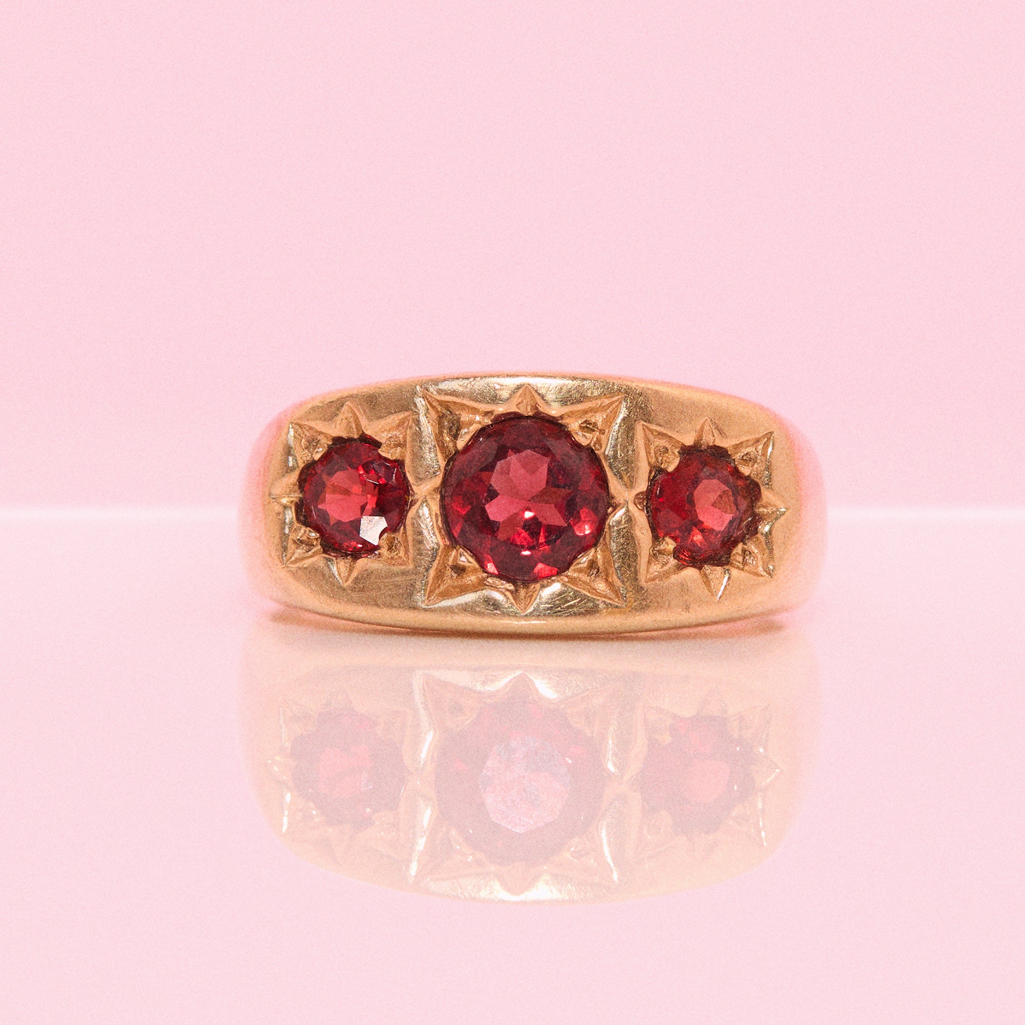 9ct gold three stone garnet ring