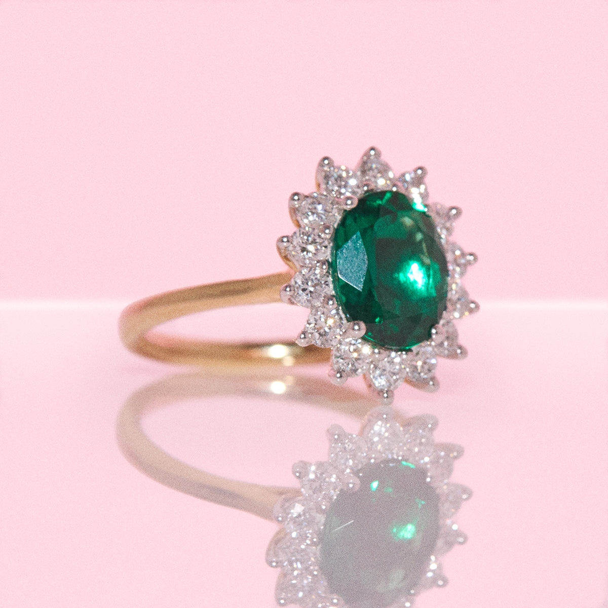 9ct gold 2.28ct oval emerald and 0.83ct diamond cluster ring