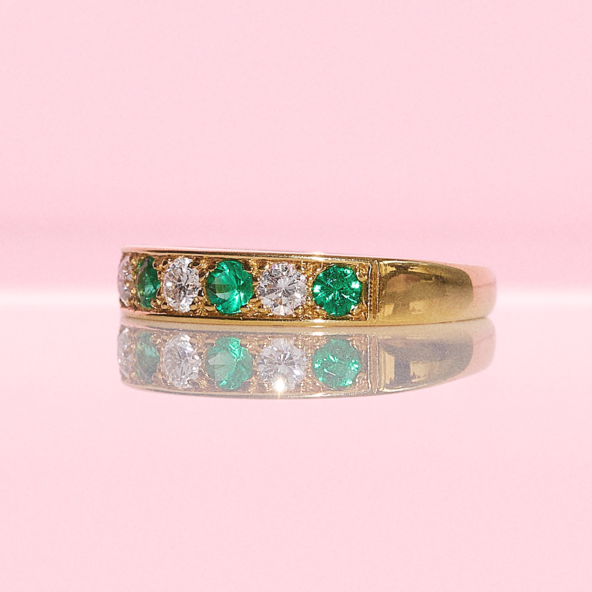 18ct gold emerald and diamond half eternity ring