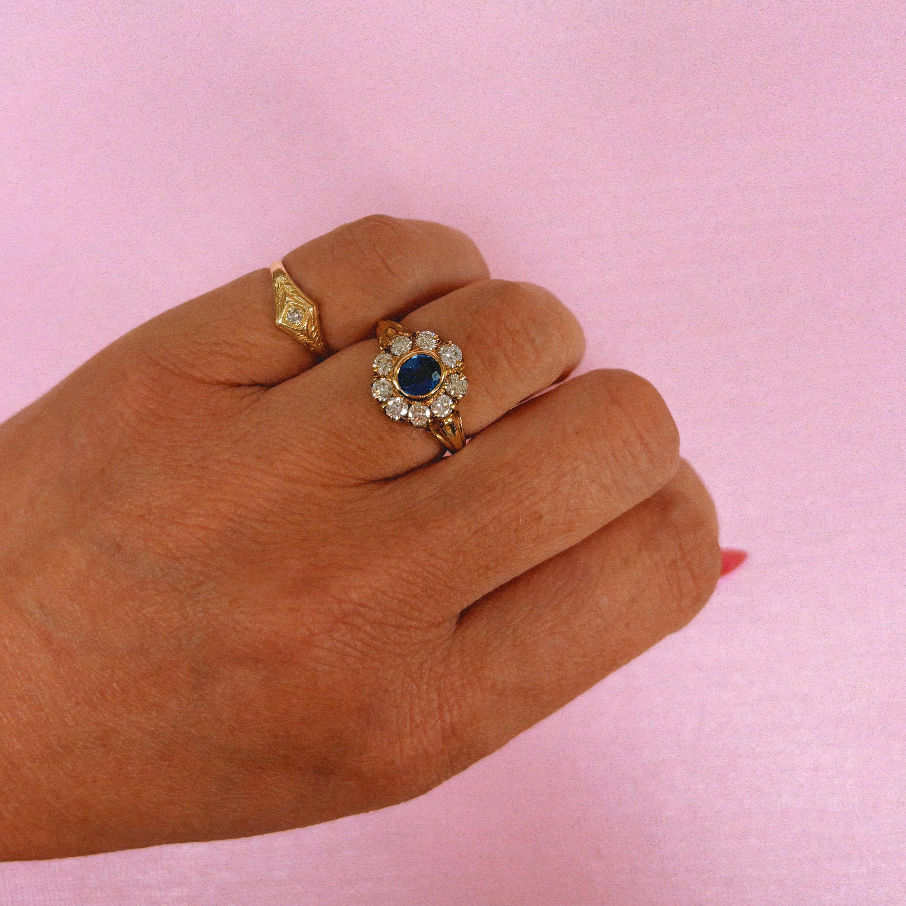 18ct gold bezel set sapphire and old cut diamond cluster ring