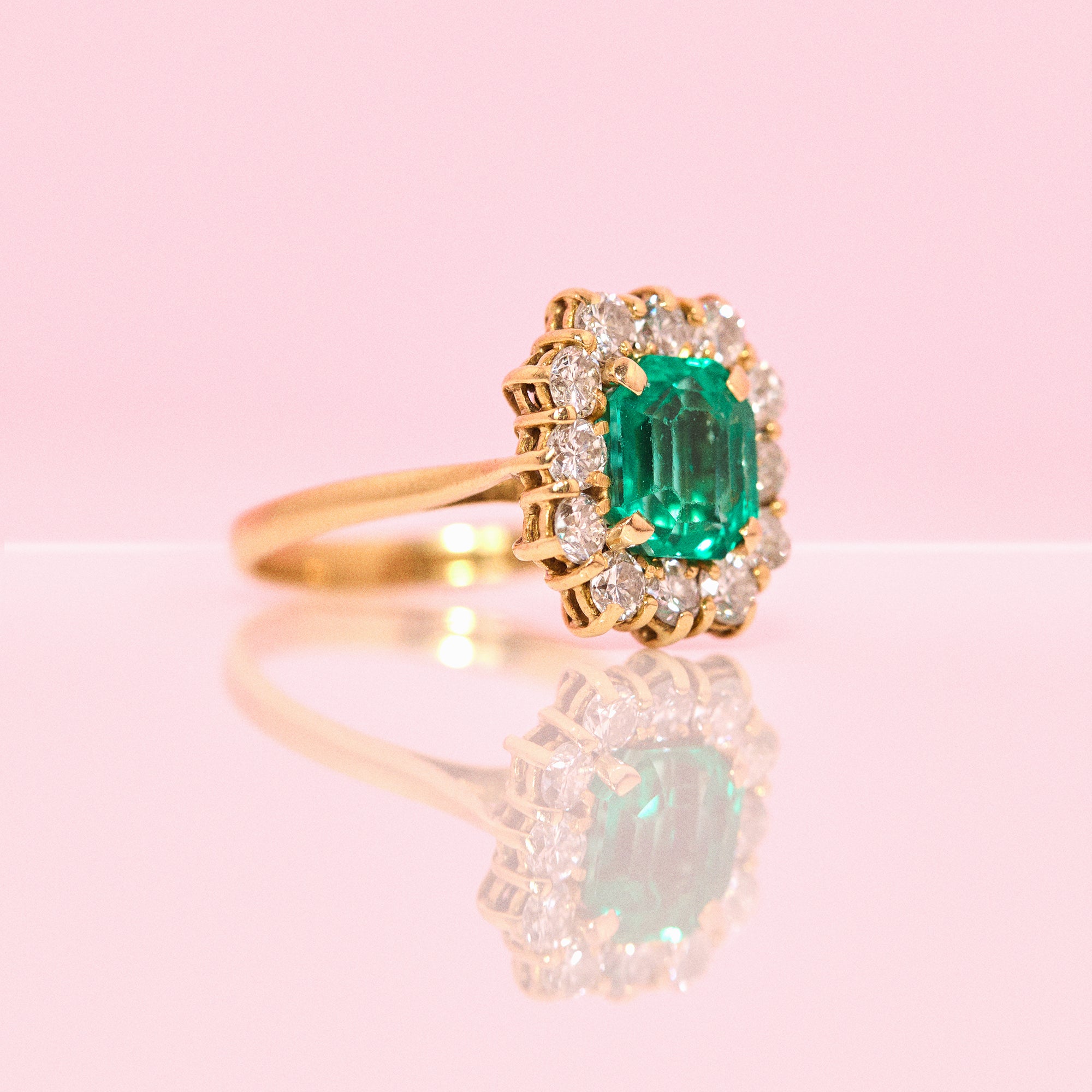 18ct gold emerald and diamond cluster ring