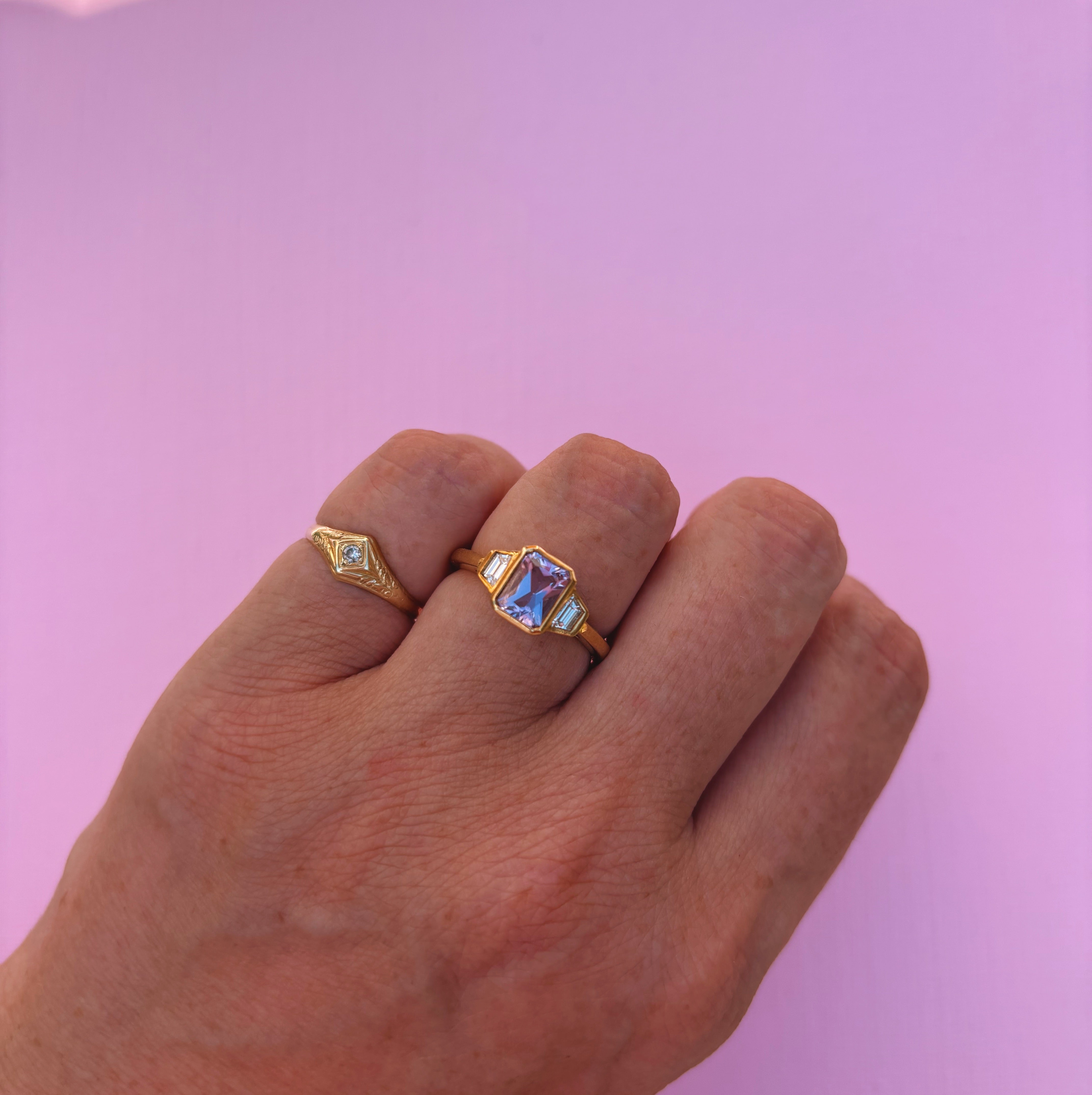 9ct gold 0.94ct emerald cut amethyst and 0.17ct diamond ring