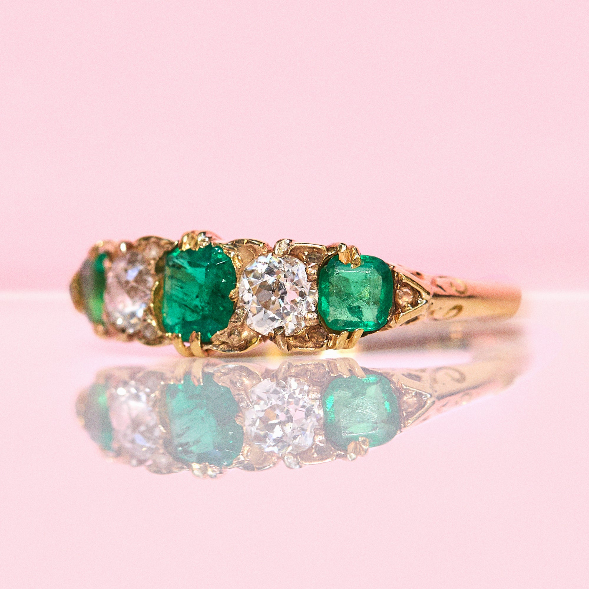 18ct gold emerald and diamond five stone carved ring