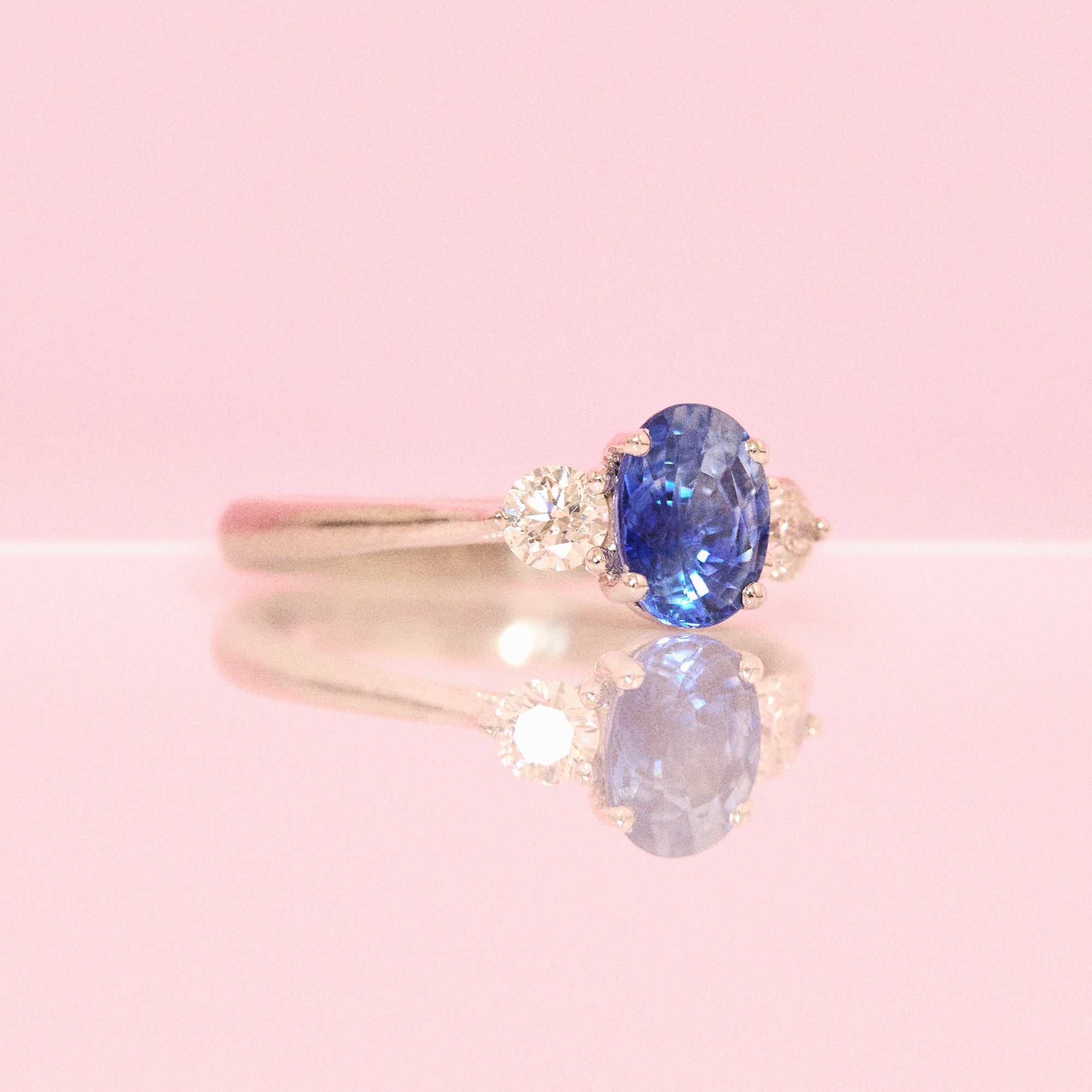 Platinum blue sapphire and diamond three stone ring (made to order)