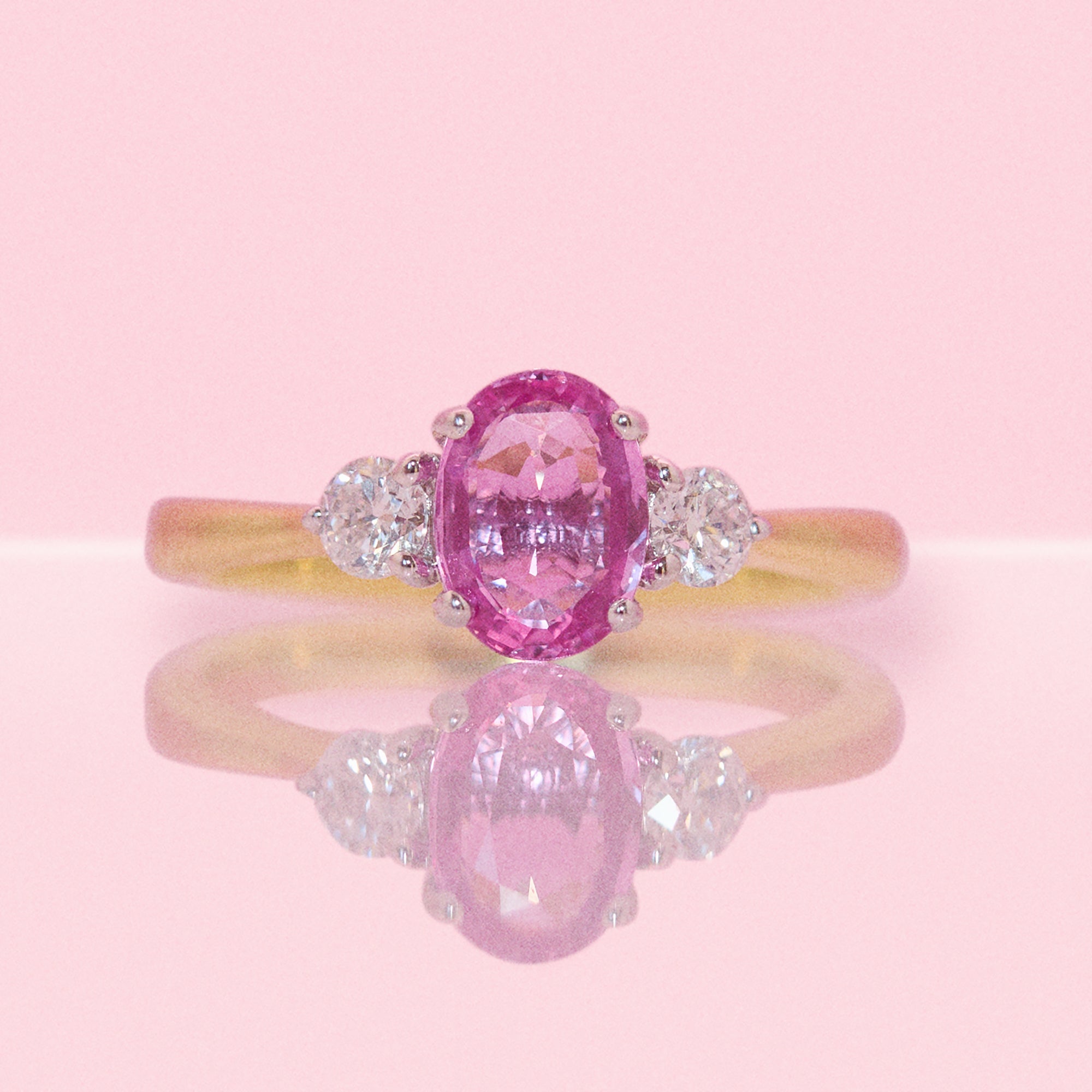 18ct gold 1.22ct pink sapphire and 0.25ct diamond three stone ring