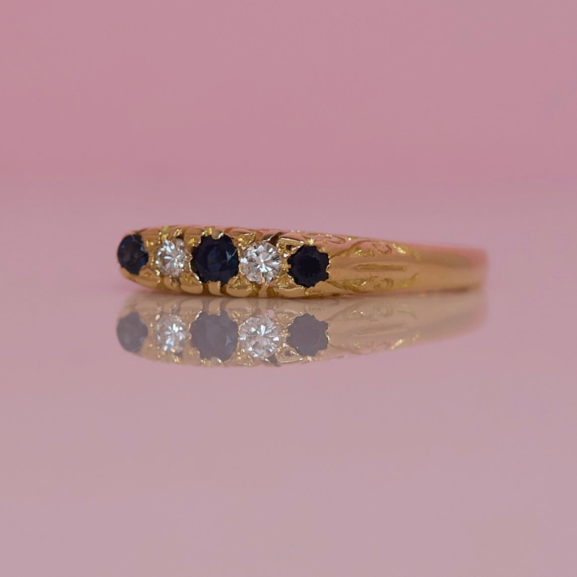 18ct gold sapphire and diamond carved ring