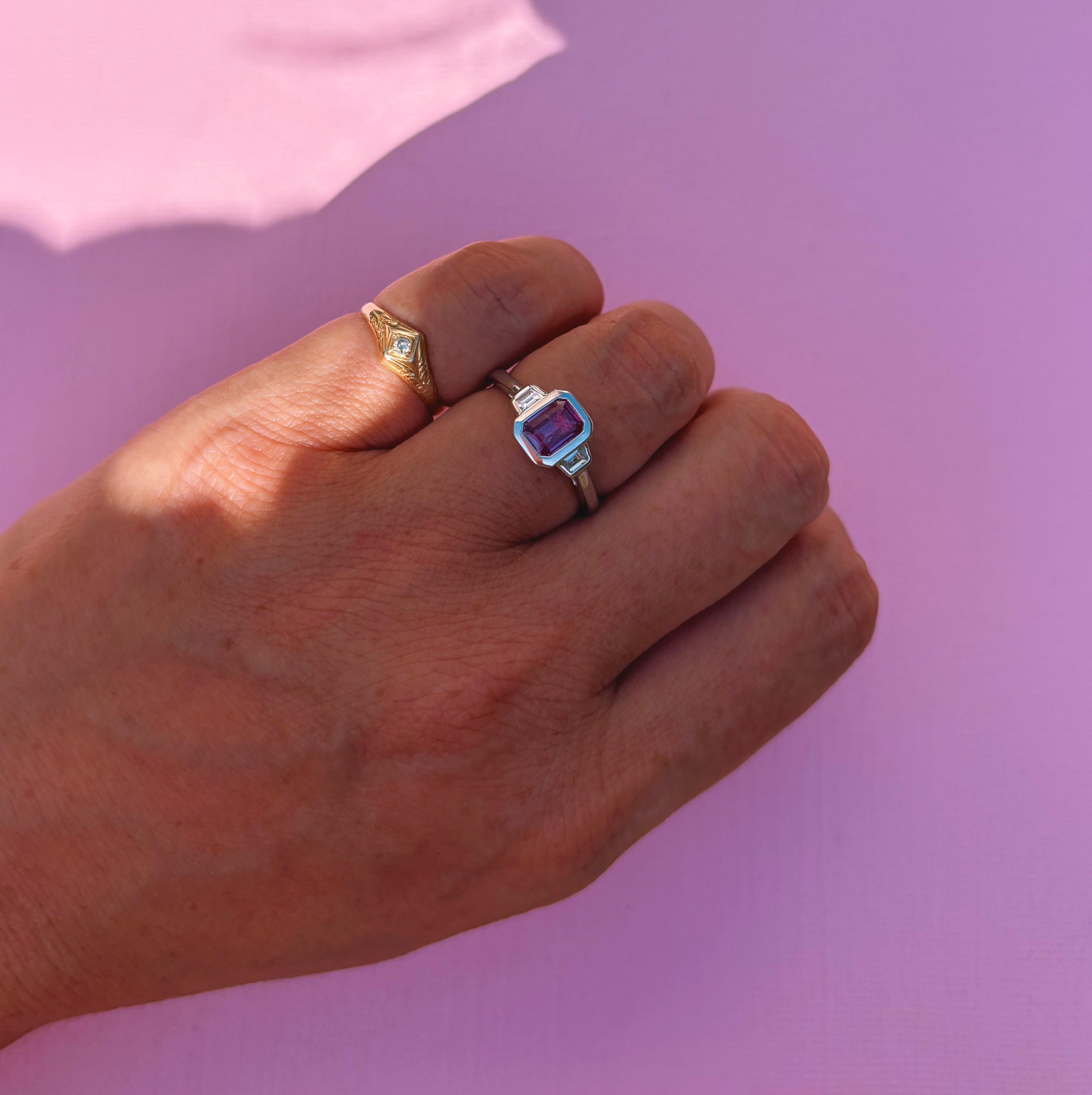 Platinum 0.95ct emerald cut pink sapphire and diamond bezel set ring