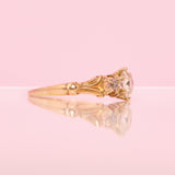 18ct gold diamond three stone ring with carved shoulders