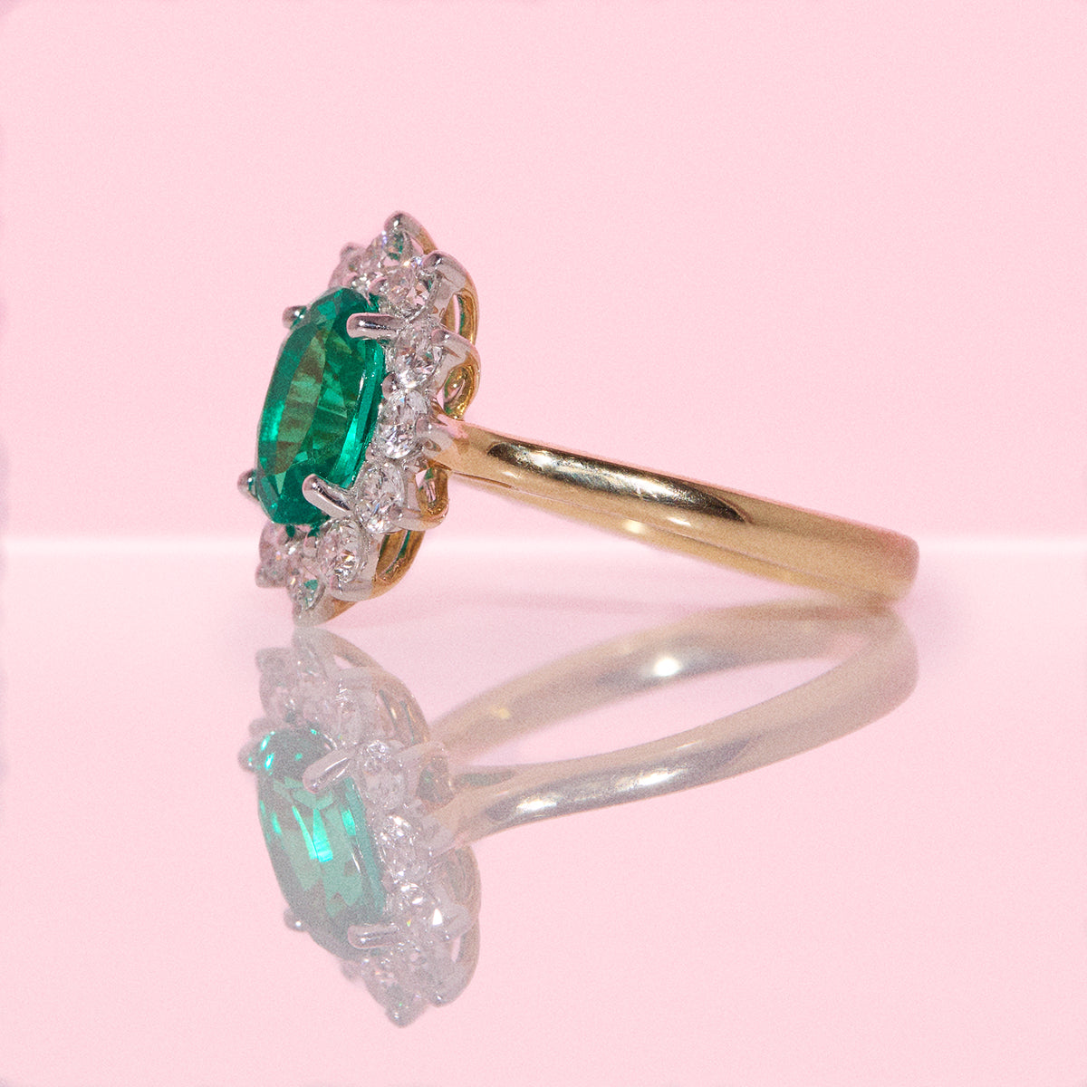 9ct gold 1.93ct oval emerald and 0.88ct diamond cluster ring