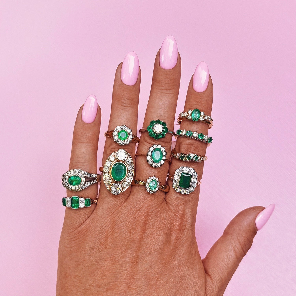 Vintage 18ct gold emerald and diamond cluster ring with a graduated band