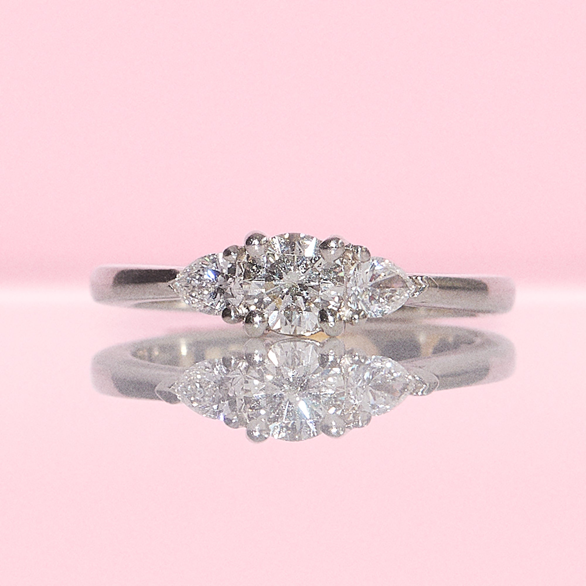 Platinum three stone tier drop diamond ring