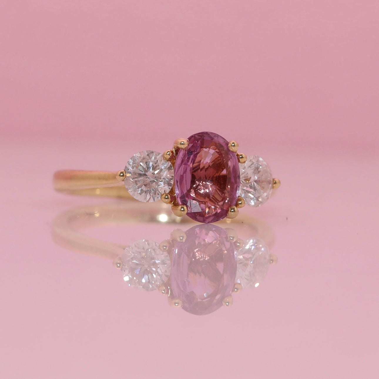 18ct gold 1.46ct pink sapphire and 0.84ct diamond three stone ring