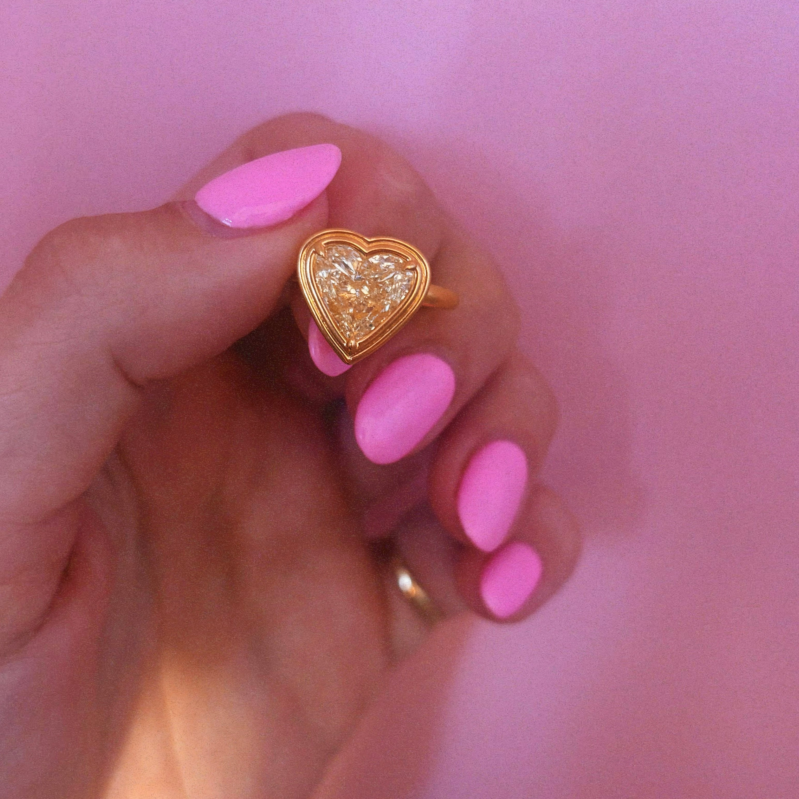 18ct gold bezel set fancy yellow 2.35ct heart-shaped diamond ring