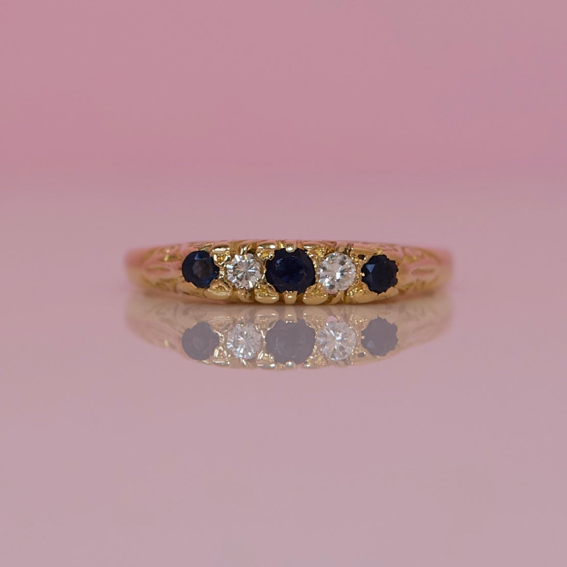 18ct gold sapphire and diamond carved ring