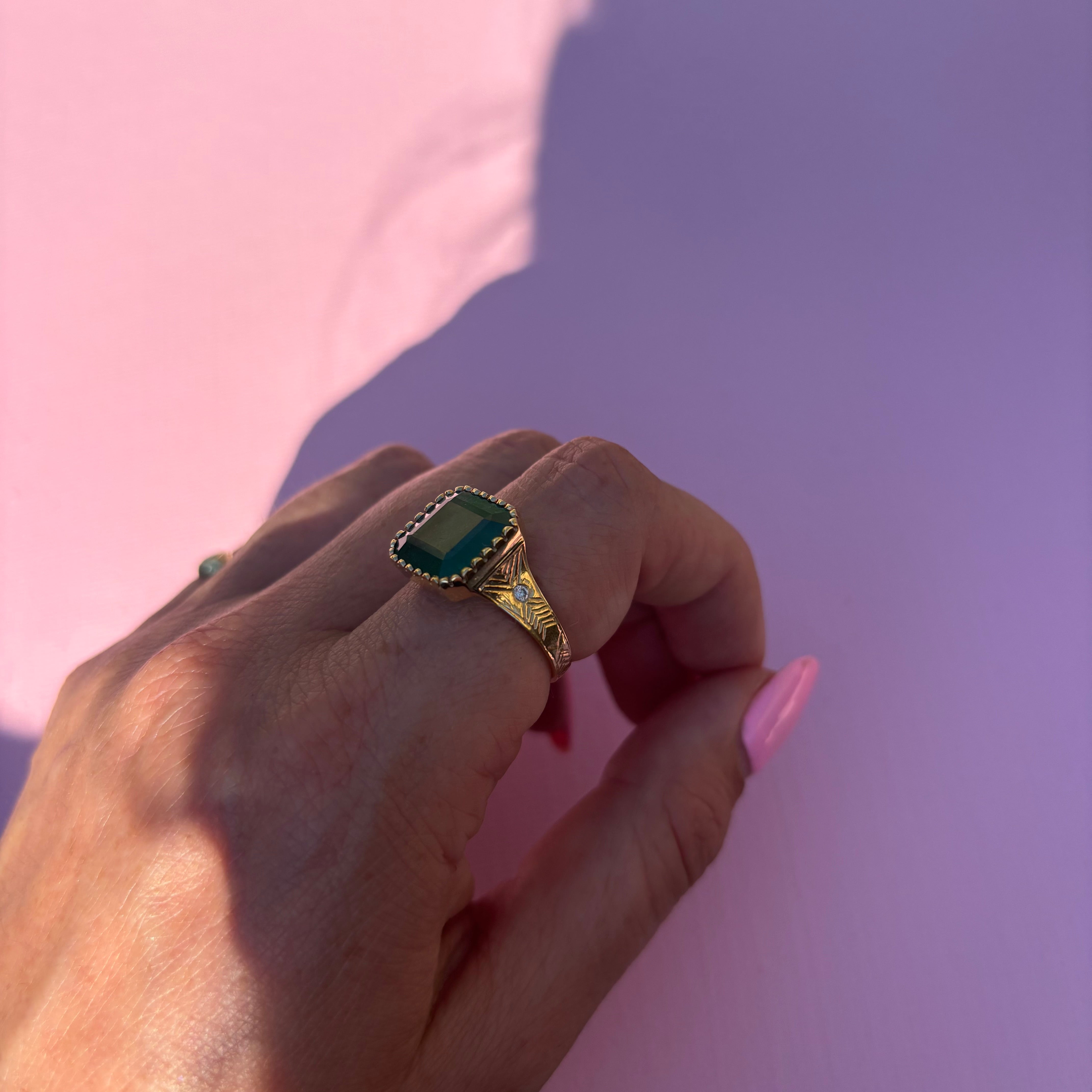 14ct gold 10.80ct Asscher cut emerald and diamond ring with engraved shoulders