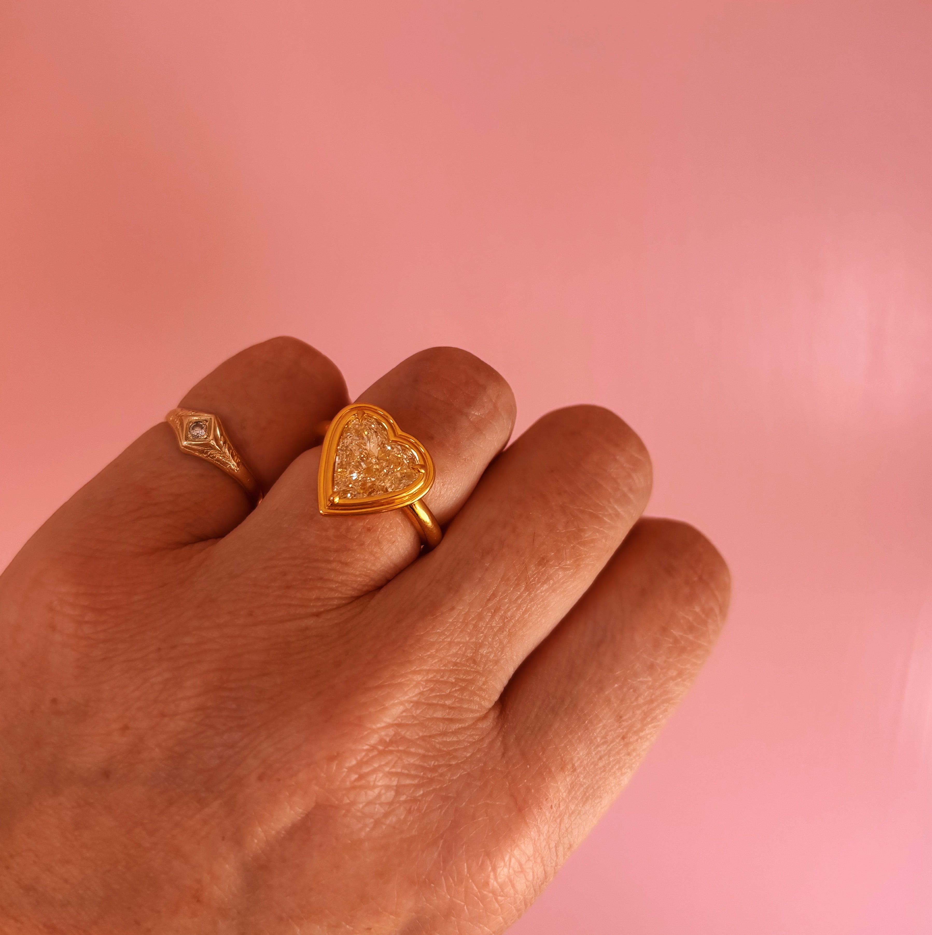 18ct gold bezel set fancy yellow 2.35ct heart-shaped diamond ring
