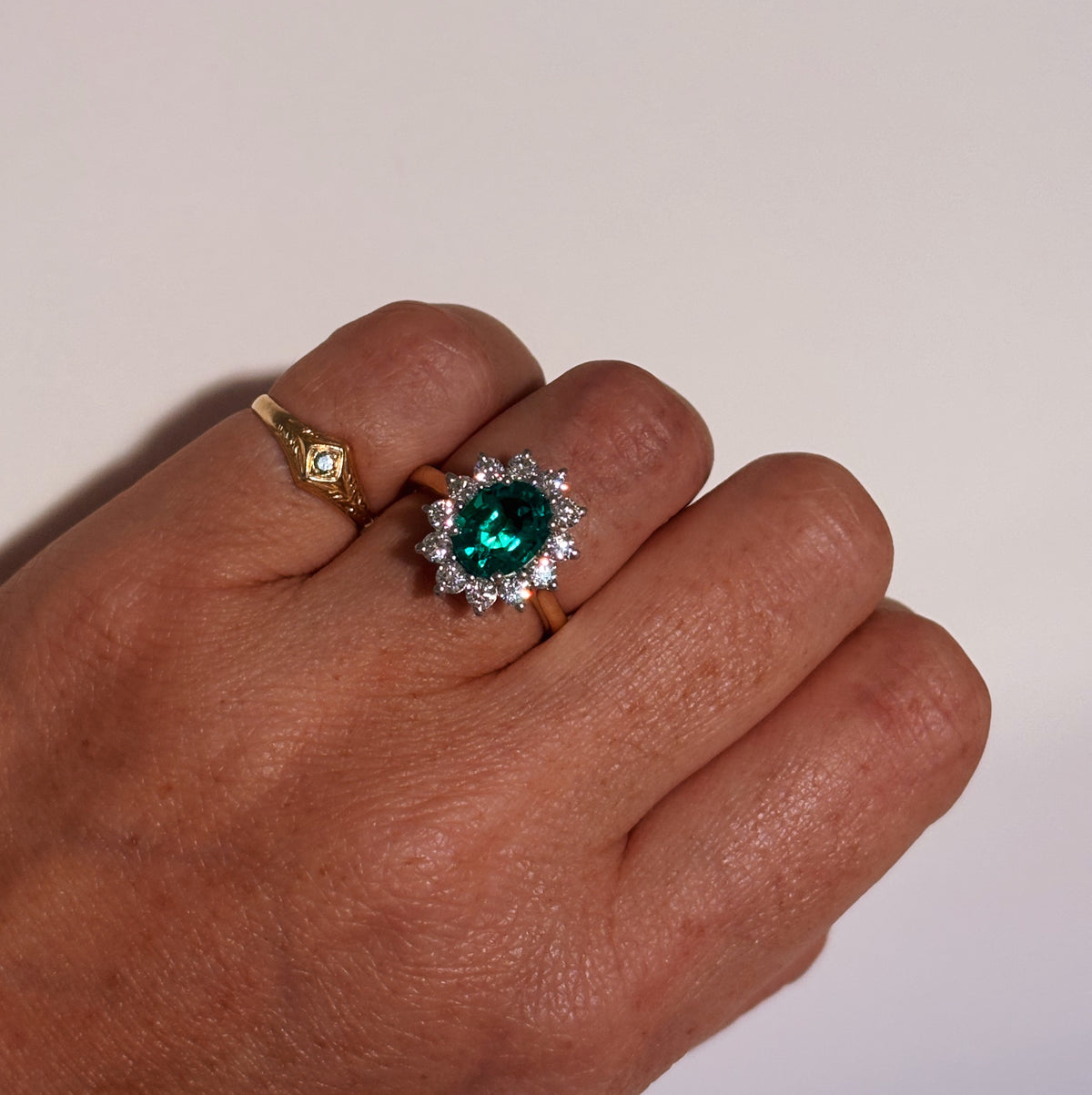9ct gold 1.93ct oval emerald and 0.88ct diamond cluster ring (lab grown)