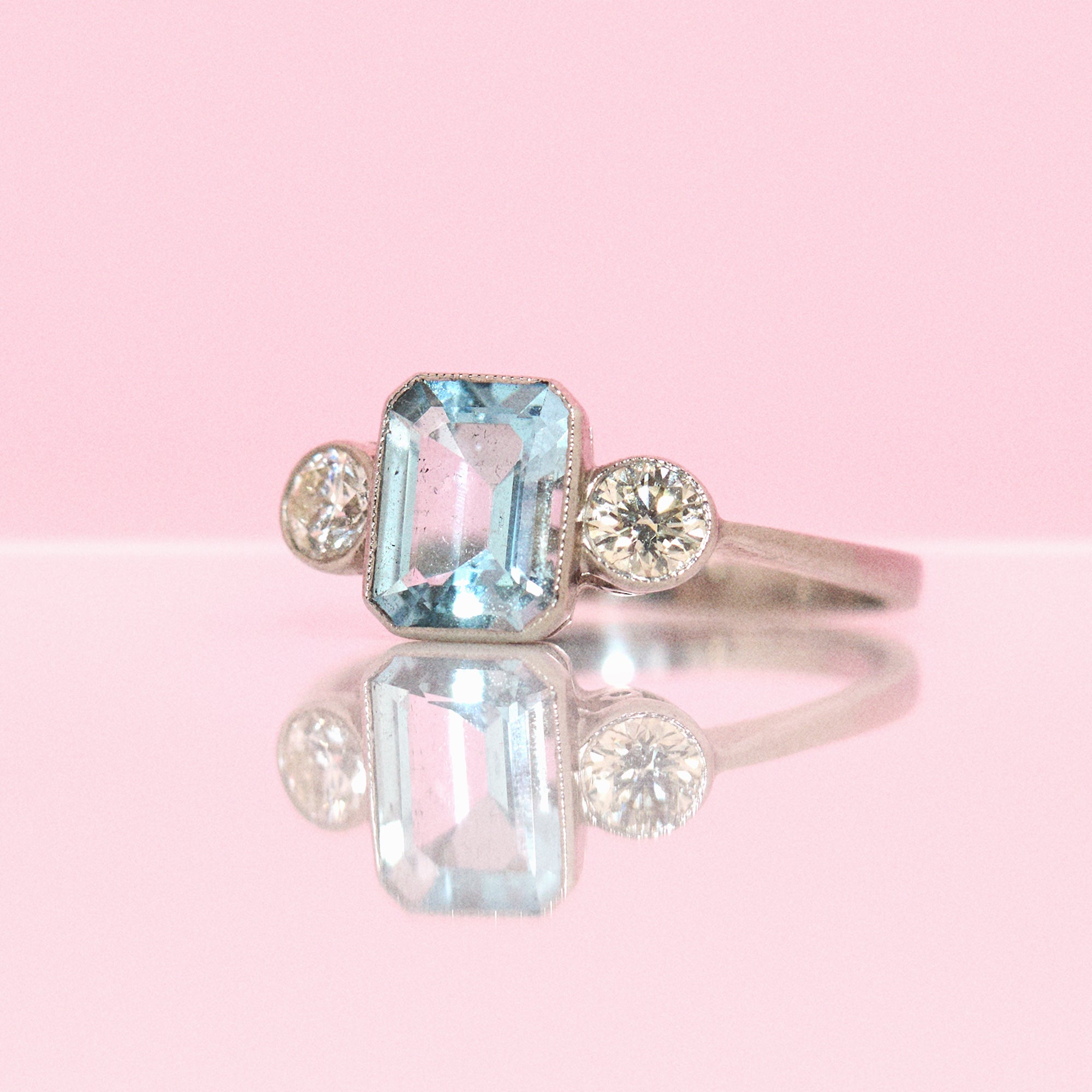 Platinum aquamarine and diamond three stone ring