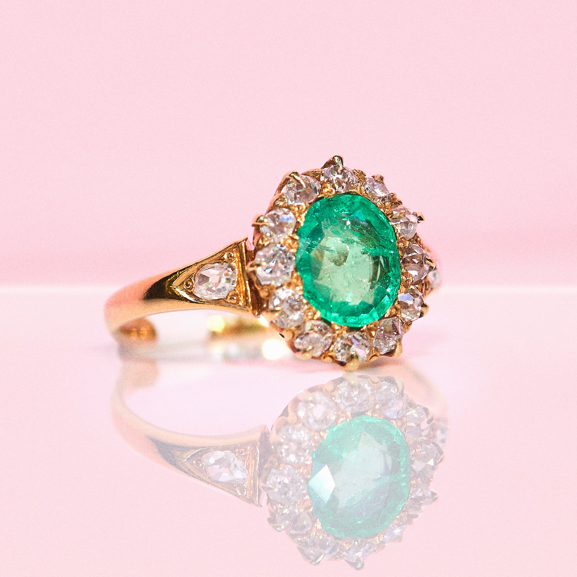 18ct gold emerald and diamond cluster ring