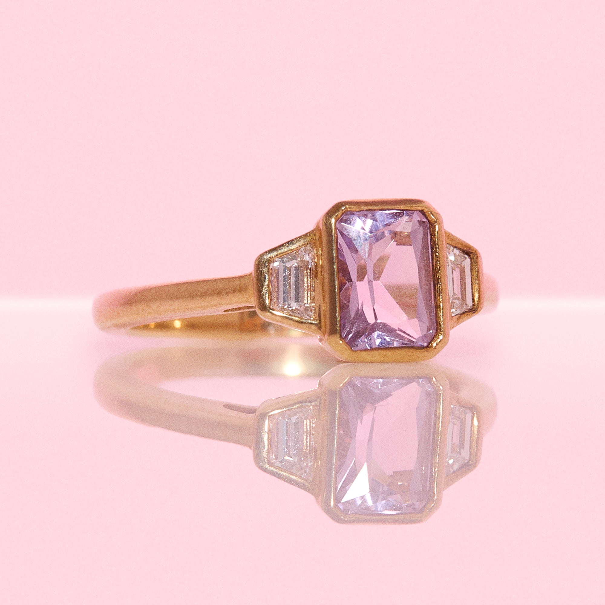 9ct gold 0.94ct emerald cut amethyst and 0.17ct diamond ring