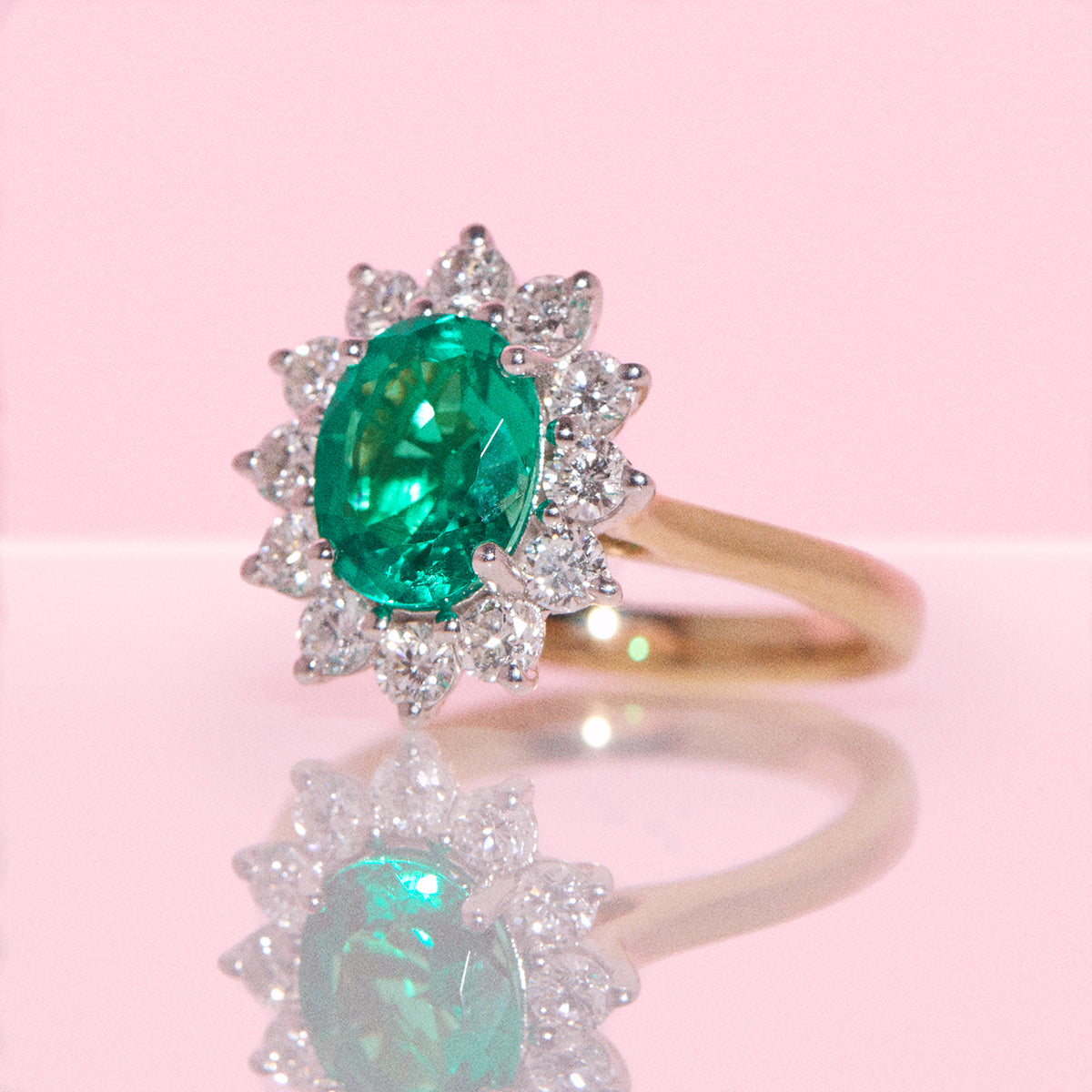 9ct gold 1.93ct oval emerald and 0.88ct diamond cluster ring